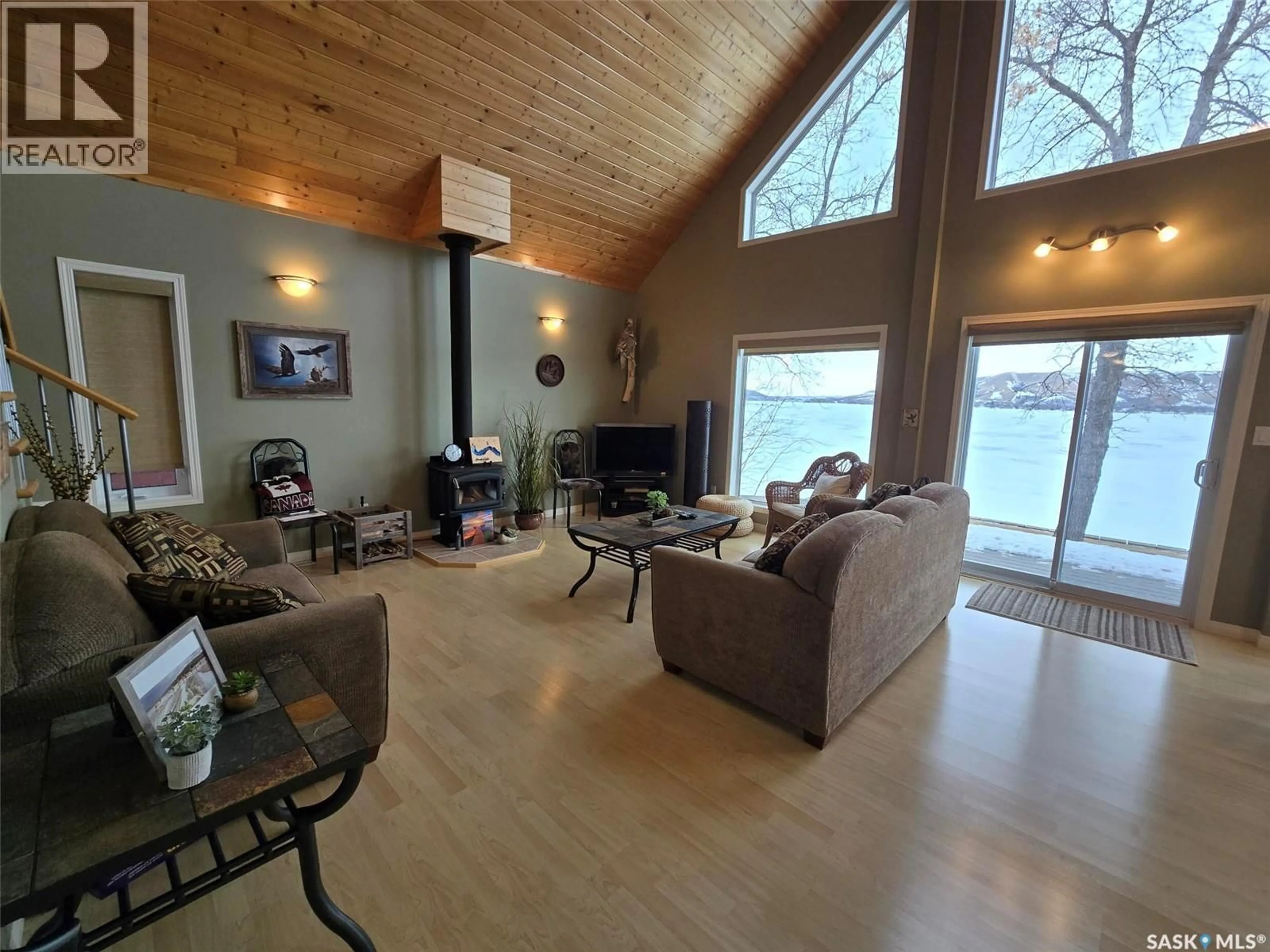 Living room with furniture, wood/laminate floor for 106 SEASHELL ROAD, Crooked Lake Saskatchewan S0G2B0