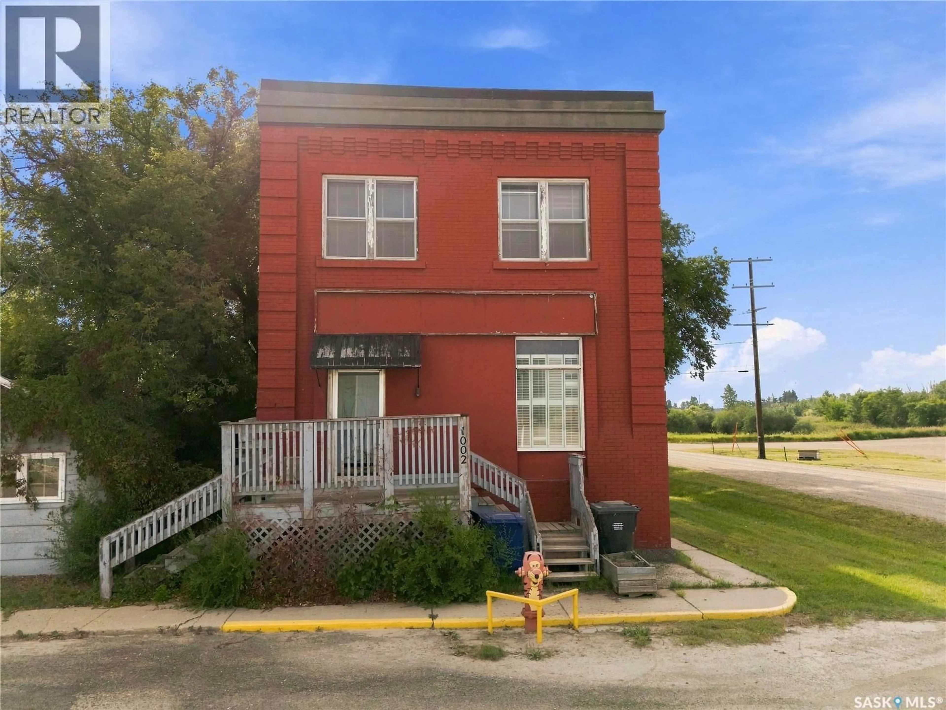 Home with brick exterior material, building for 1002 9TH STREET, Perdue Saskatchewan S0K3C0
