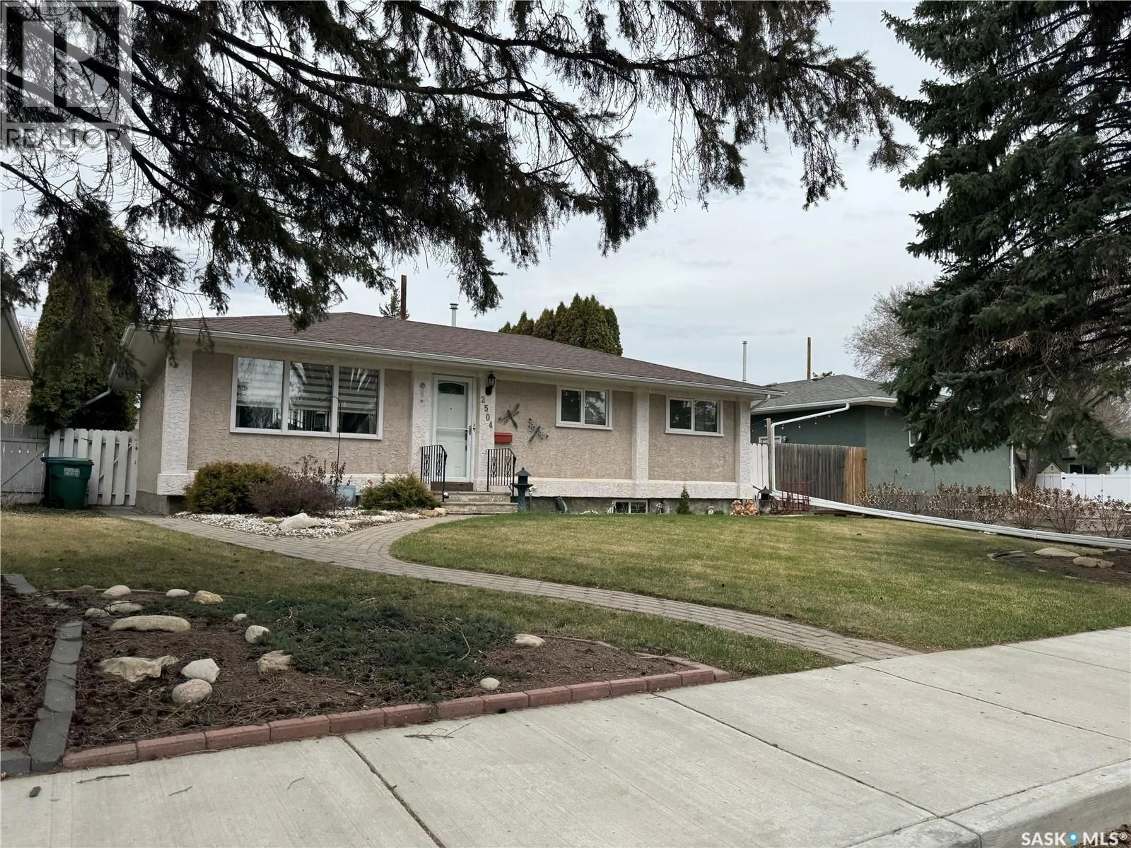 Home with vinyl exterior material, street for 2504 TOMLINSON CRESCENT, Saskatoon Saskatchewan S7L3N2