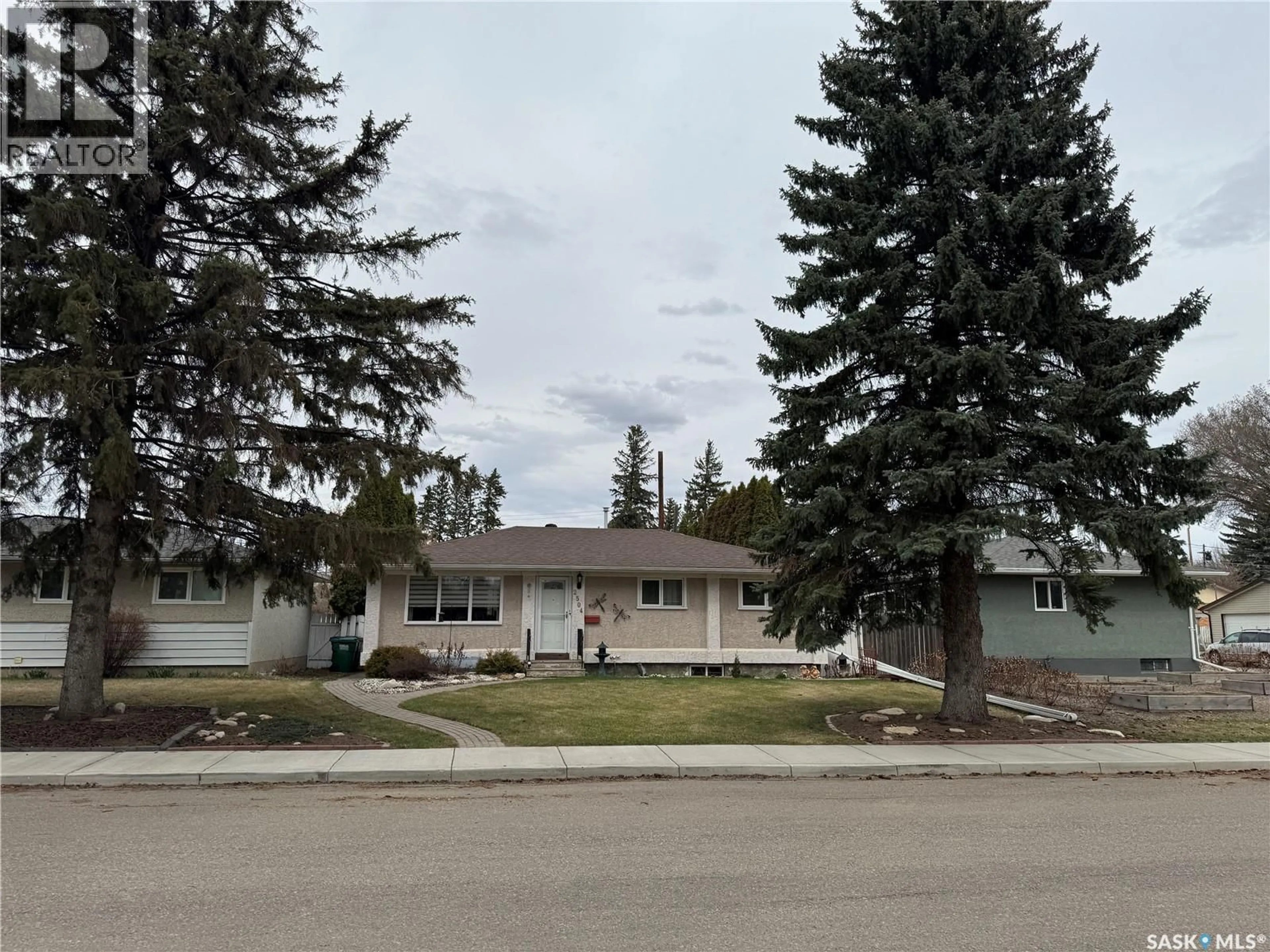 Home with vinyl exterior material, street for 2504 TOMLINSON CRESCENT, Saskatoon Saskatchewan S7L3N2