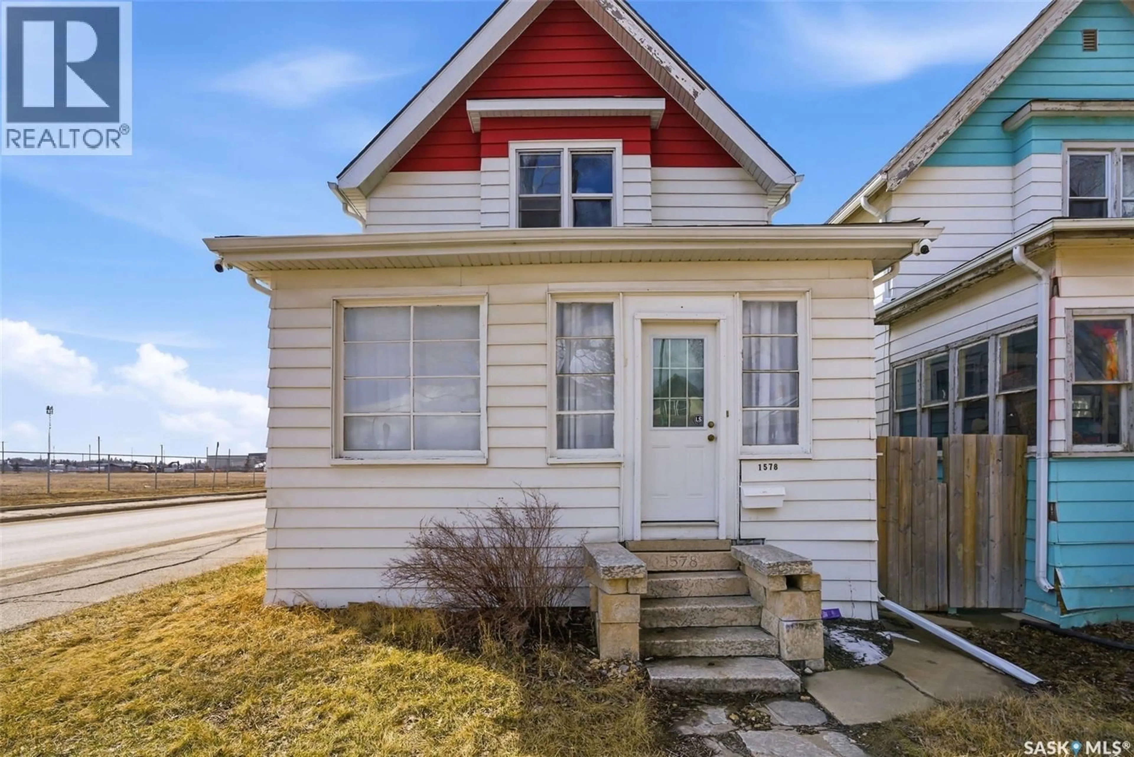 Home with vinyl exterior material, street for 1578 RETALLACK STREET, Regina Saskatchewan S4T2J4