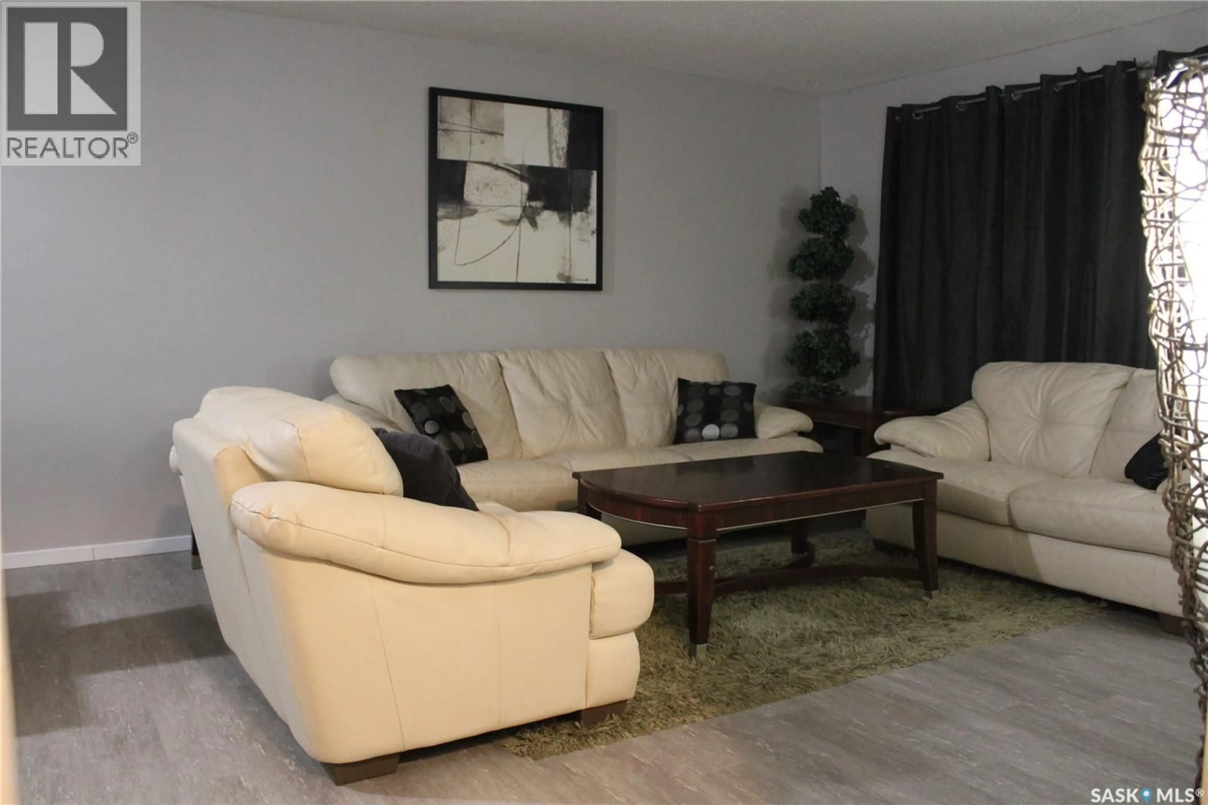 Living room with furniture, wood/laminate floor for A&B - 81 CIRCLEBROOKE DRIVE, Yorkton Saskatchewan S3N2C9
