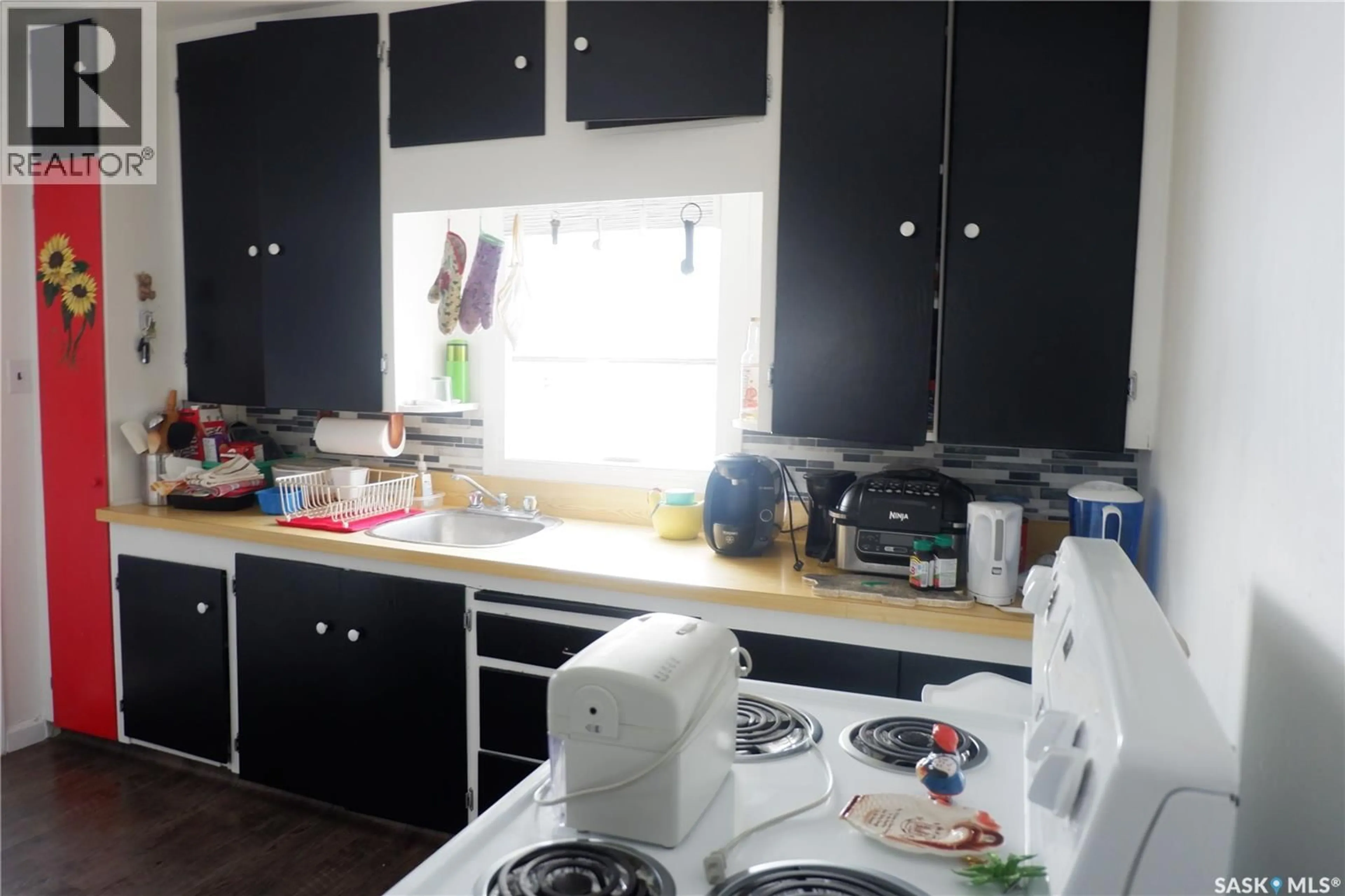 Standard kitchen, wood/laminate floor for E - 110 RAILWAY AVENUE, Eyebrow Saskatchewan S0H1L0