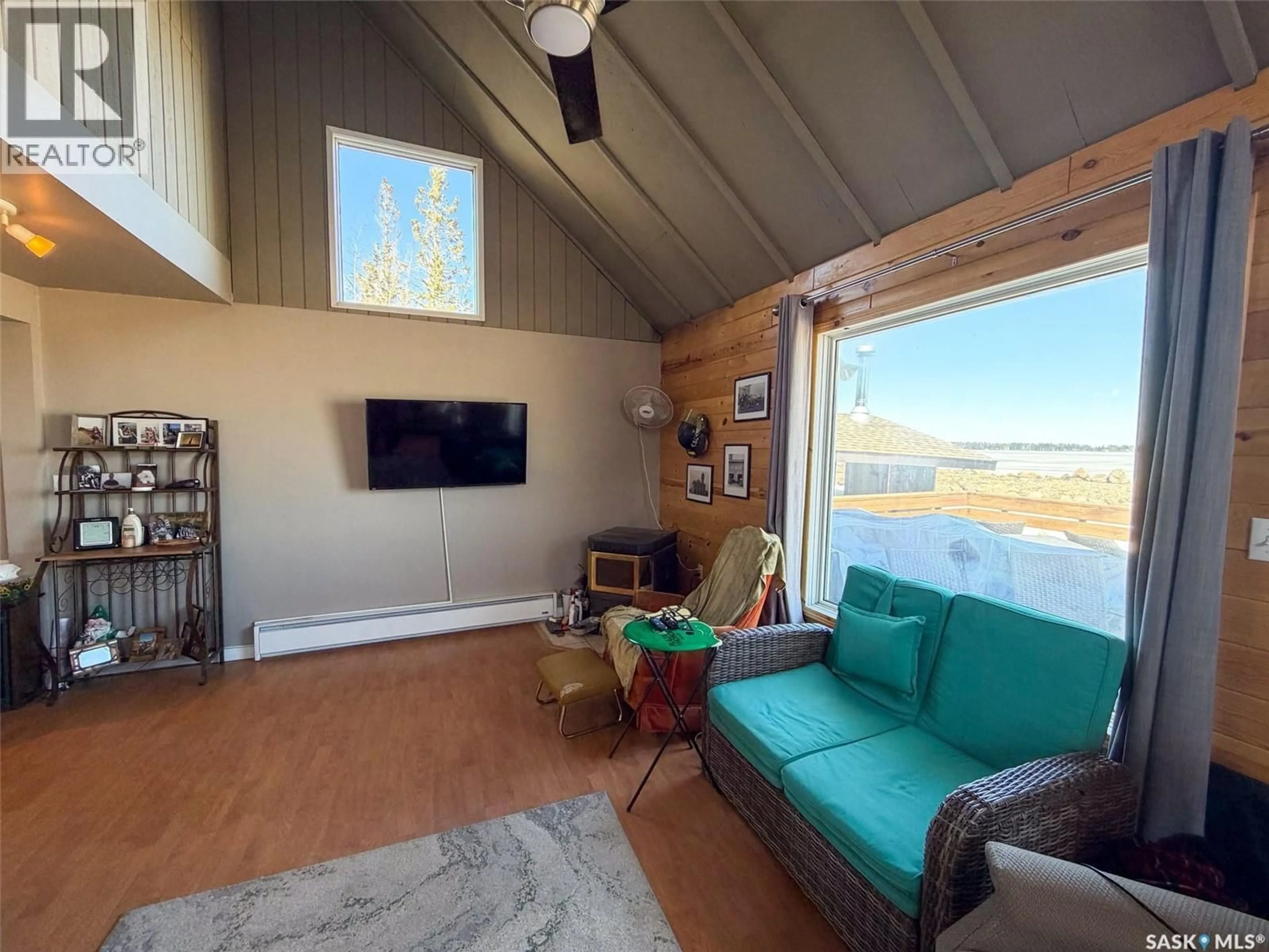 Living room with furniture, wood/laminate floor for MEETING LAKE CABIN, Meeting Lake Saskatchewan S0M2L0