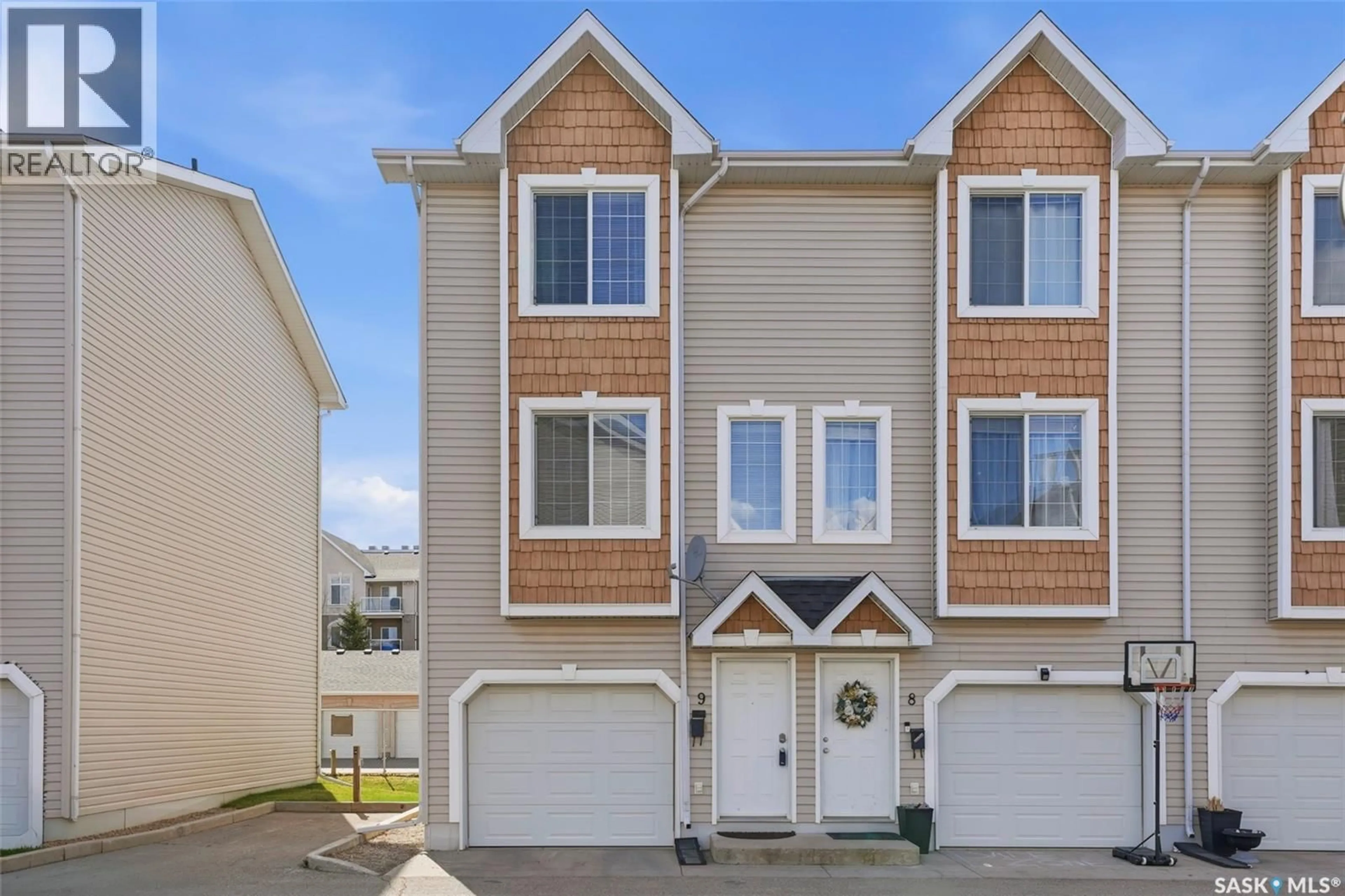 Home with vinyl exterior material, street for 9 243 HEROLD TERRACE, Saskatoon Saskatchewan S7V1J5