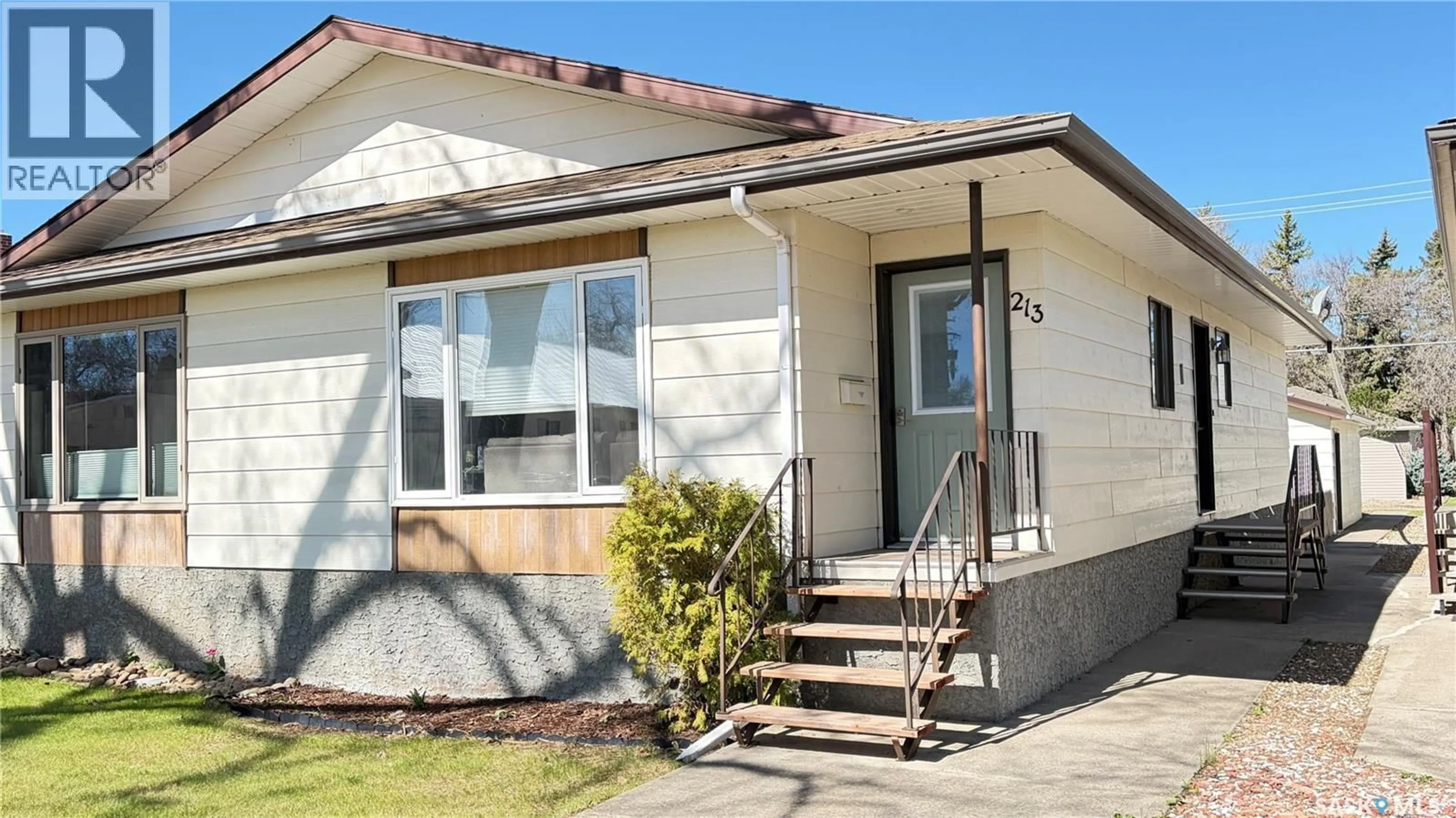 Home with vinyl exterior material, street for 213 MAPLE STREET, Maple Creek Saskatchewan S0N1N0