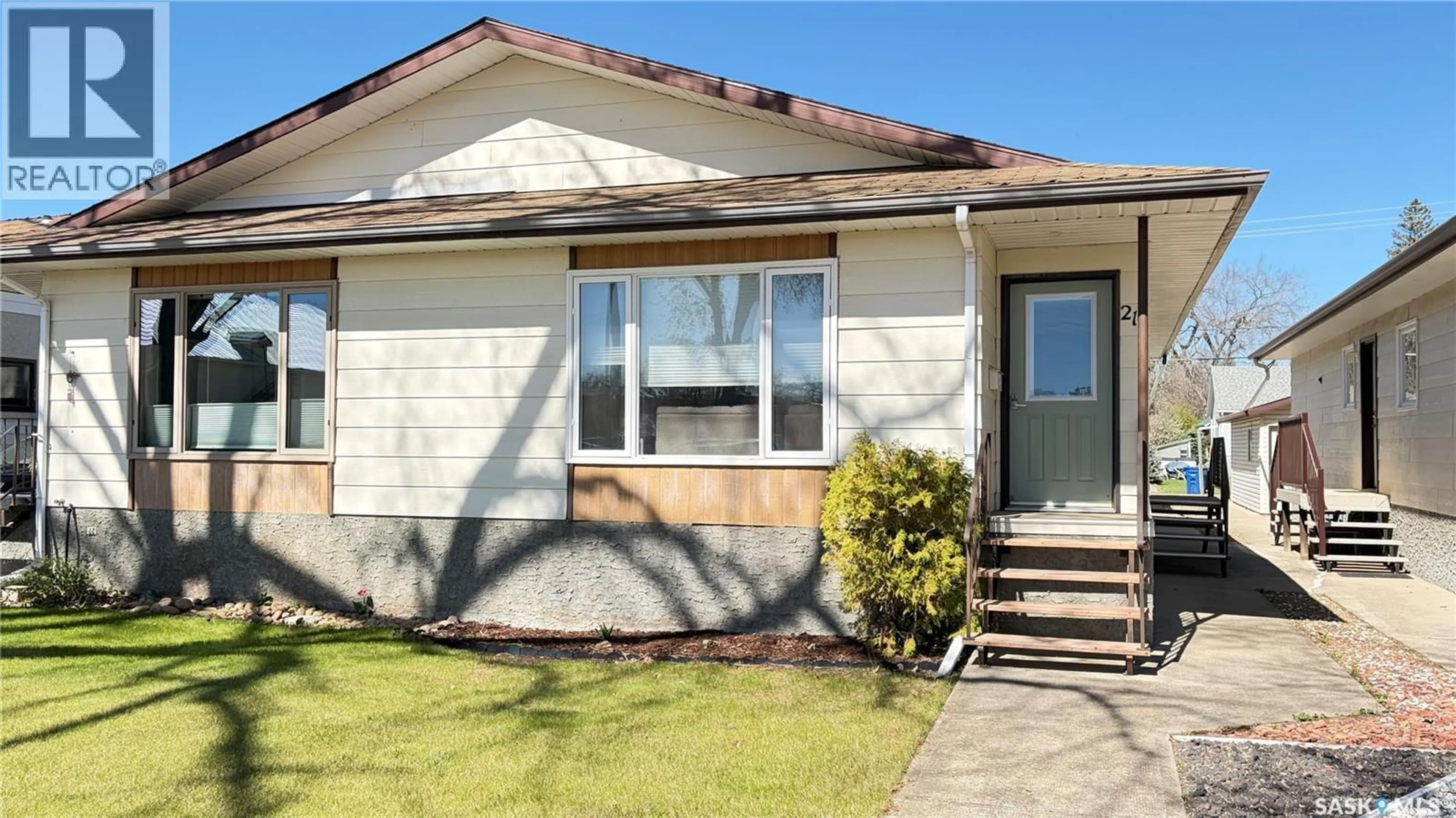 Home with vinyl exterior material, street for 213 MAPLE STREET, Maple Creek Saskatchewan S0N1N0