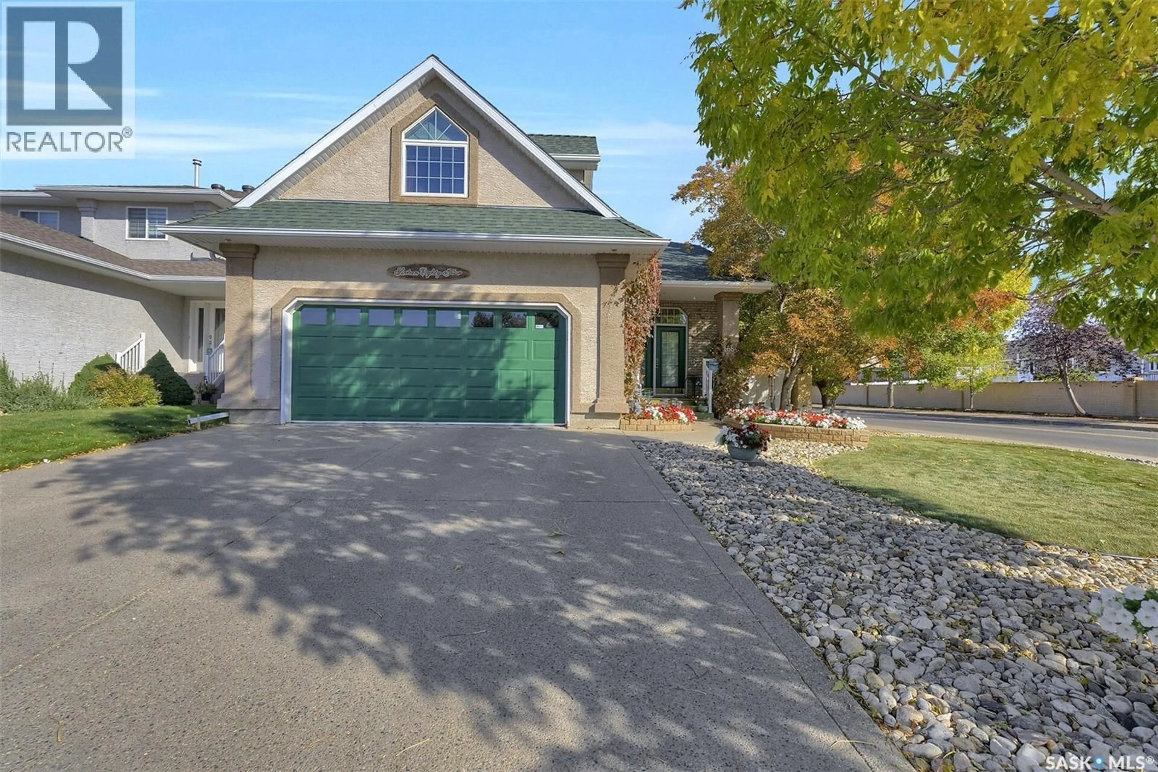 Home with vinyl exterior material, street for 1684 FENWICK CRESCENT, Regina Saskatchewan S4X4N4