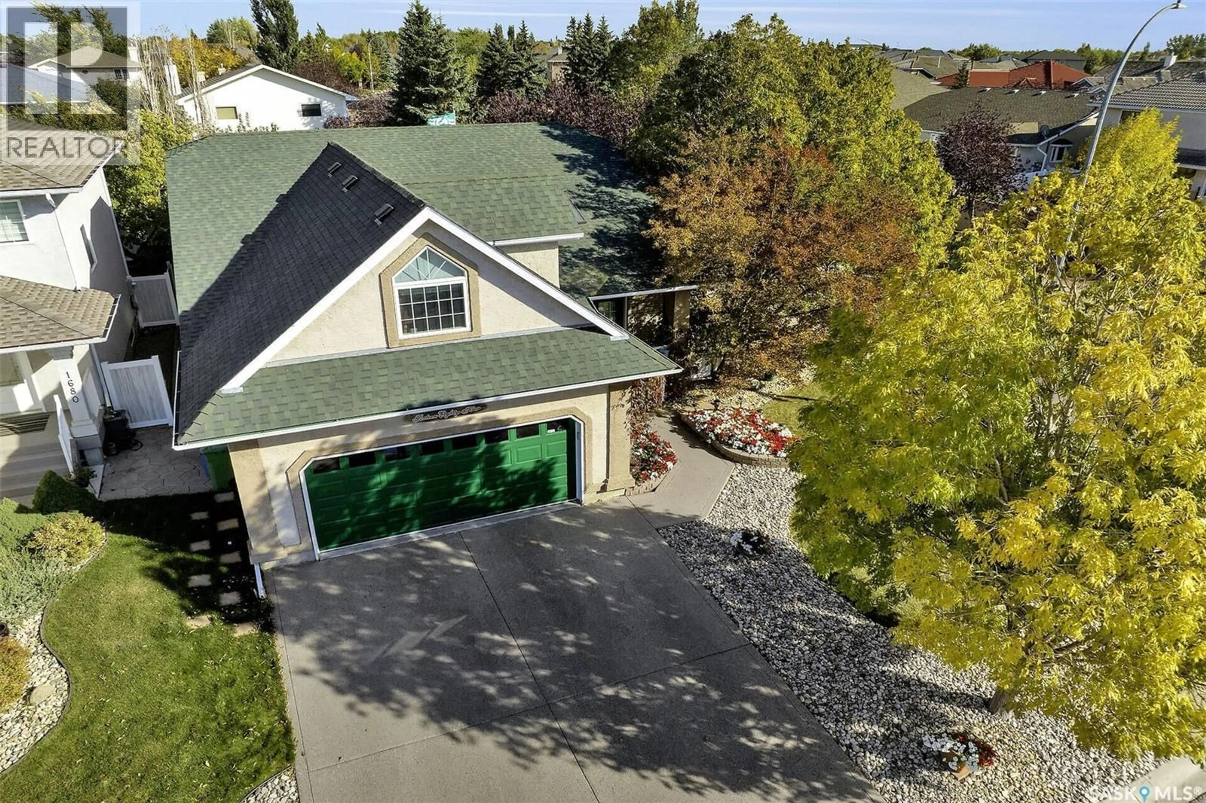 A pic from outside/outdoor area/front of a property/back of a property/a pic from drone, street for 1684 FENWICK CRESCENT, Regina Saskatchewan S4X4N4
