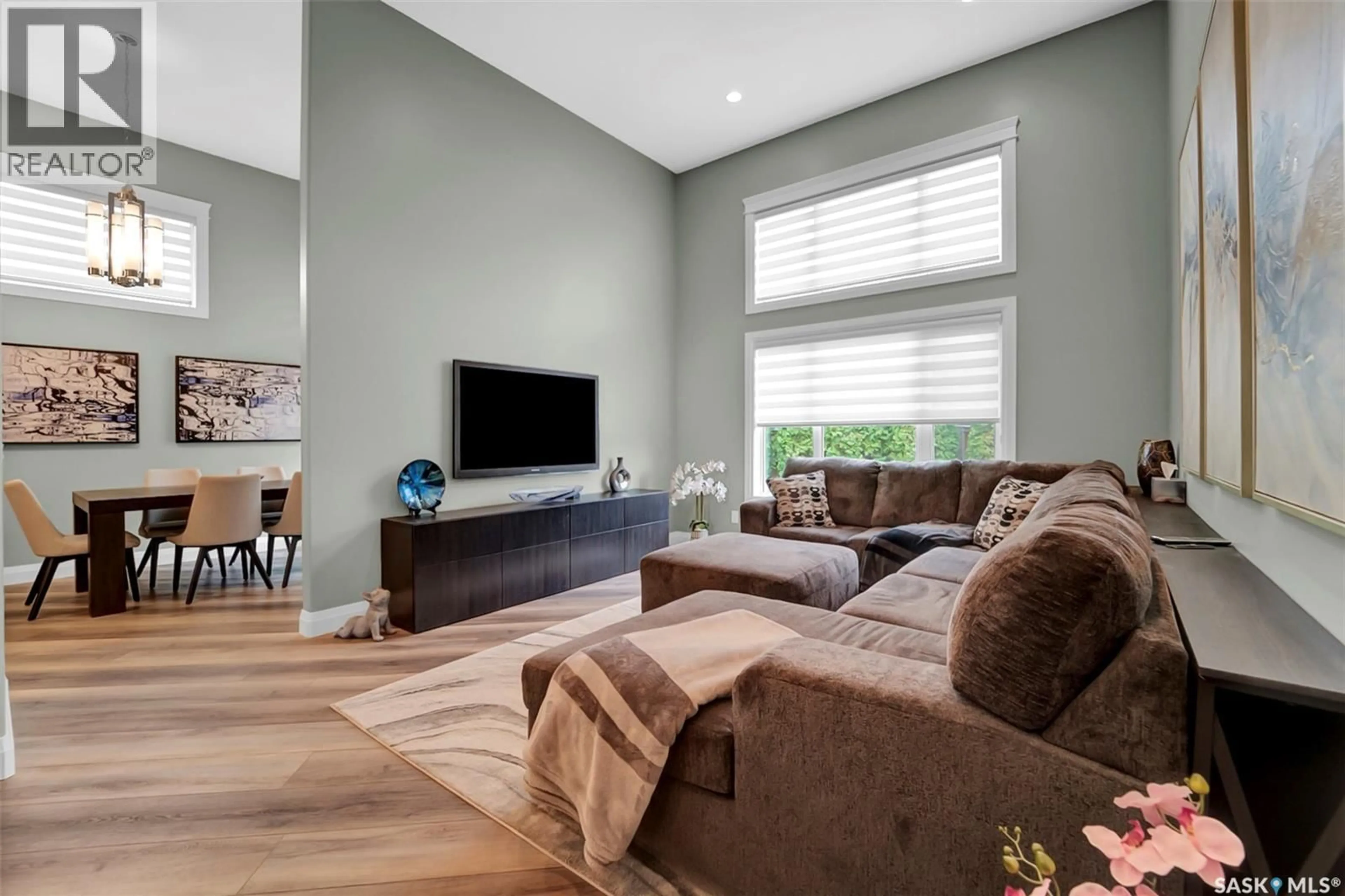 Living room with furniture, wood/laminate floor for 303 BROOKMORE CRESCENT, Saskatoon Saskatchewan S7V0B1