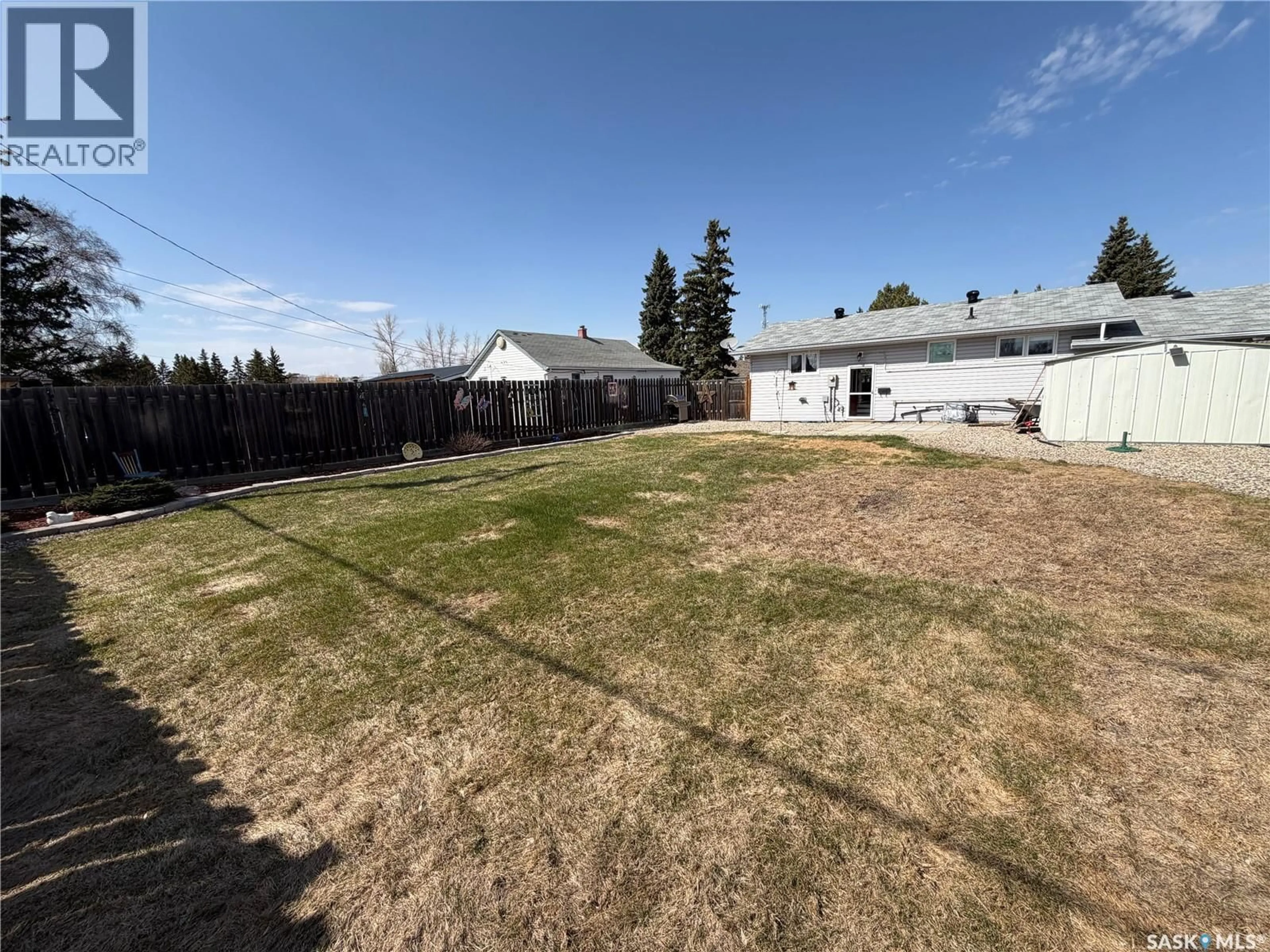 A pic from outside/outdoor area/front of a property/back of a property/a pic from drone, unknown for E - 319 MARCH AVENUE, Langenburg Saskatchewan S0A2A0