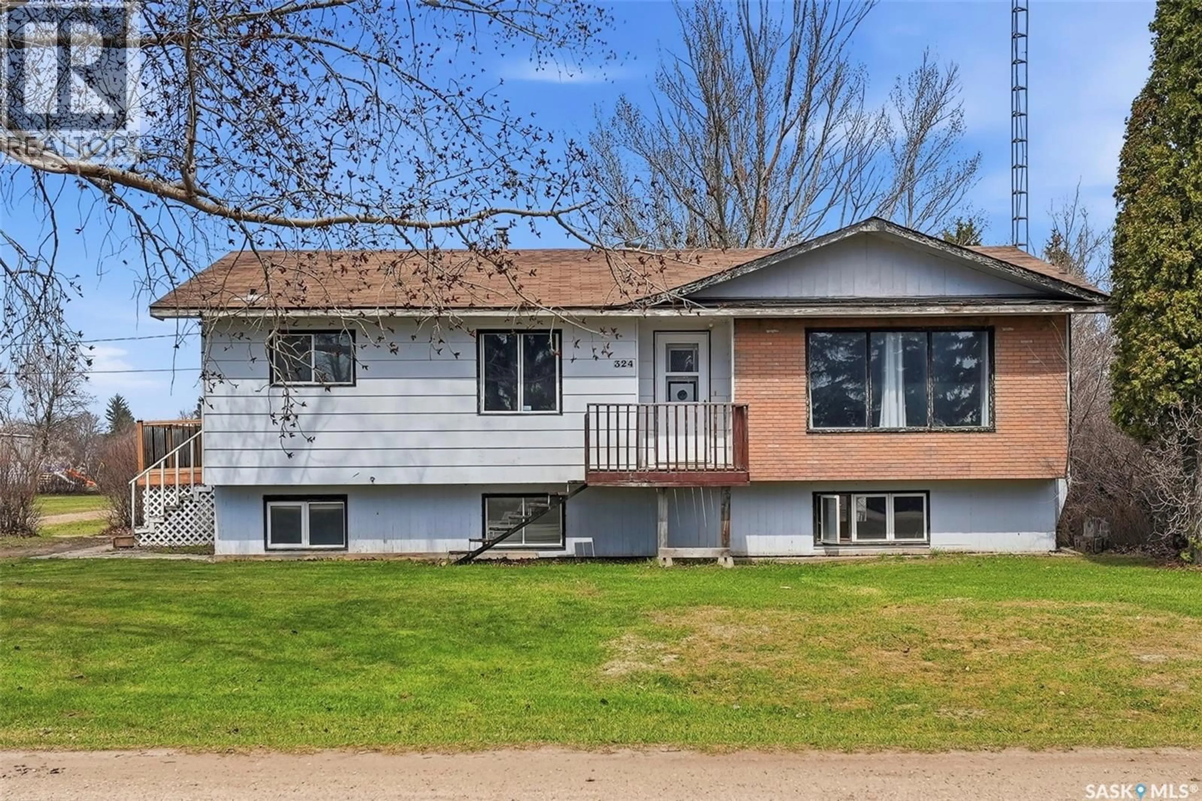 Home with vinyl exterior material, street for 324 NORREYS STREET, Drake Saskatchewan S0K1H0