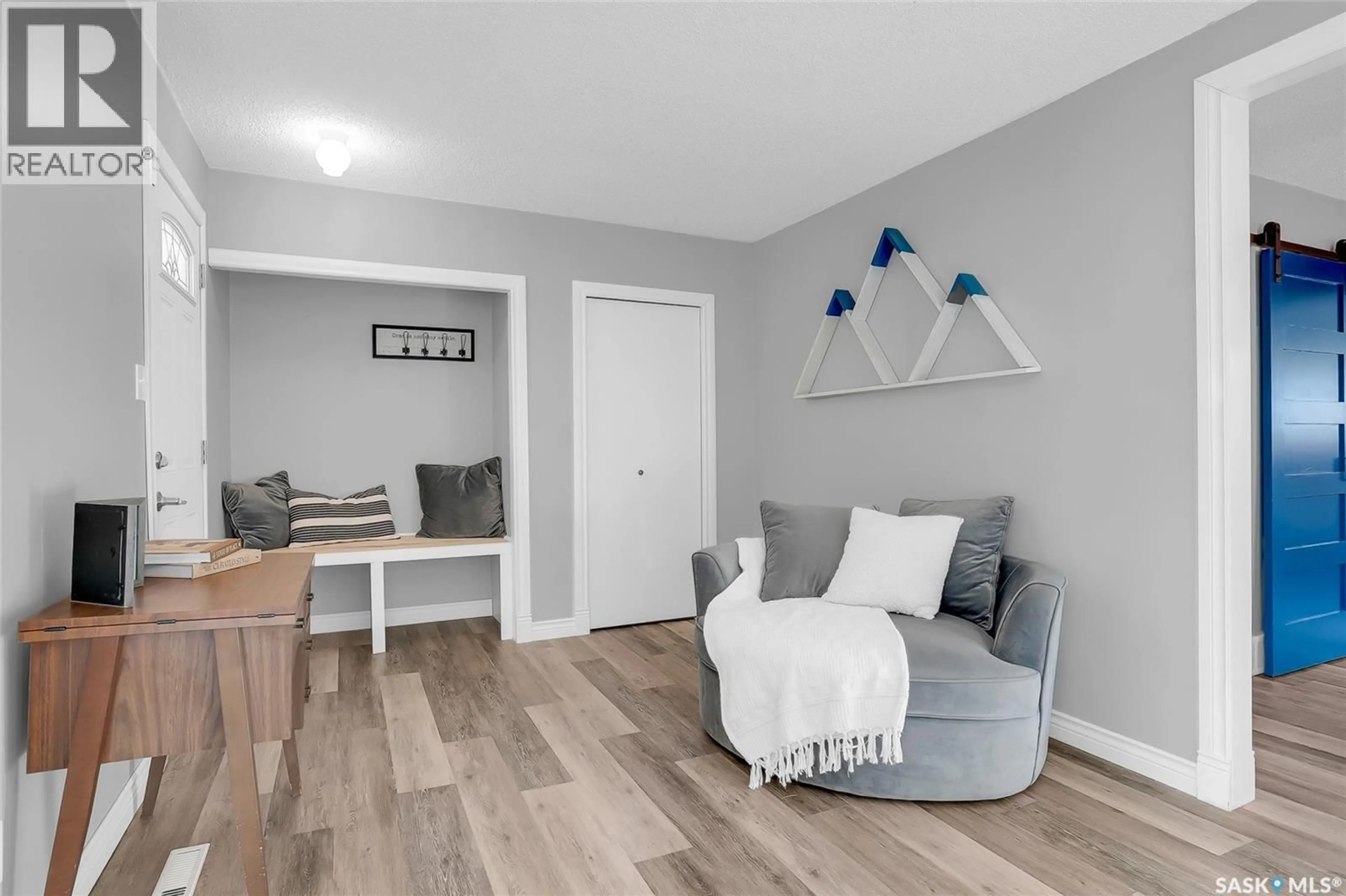 Living room with furniture, wood/laminate floor for 1314 6TH AVENUE, Saskatoon Saskatchewan S7K2T8