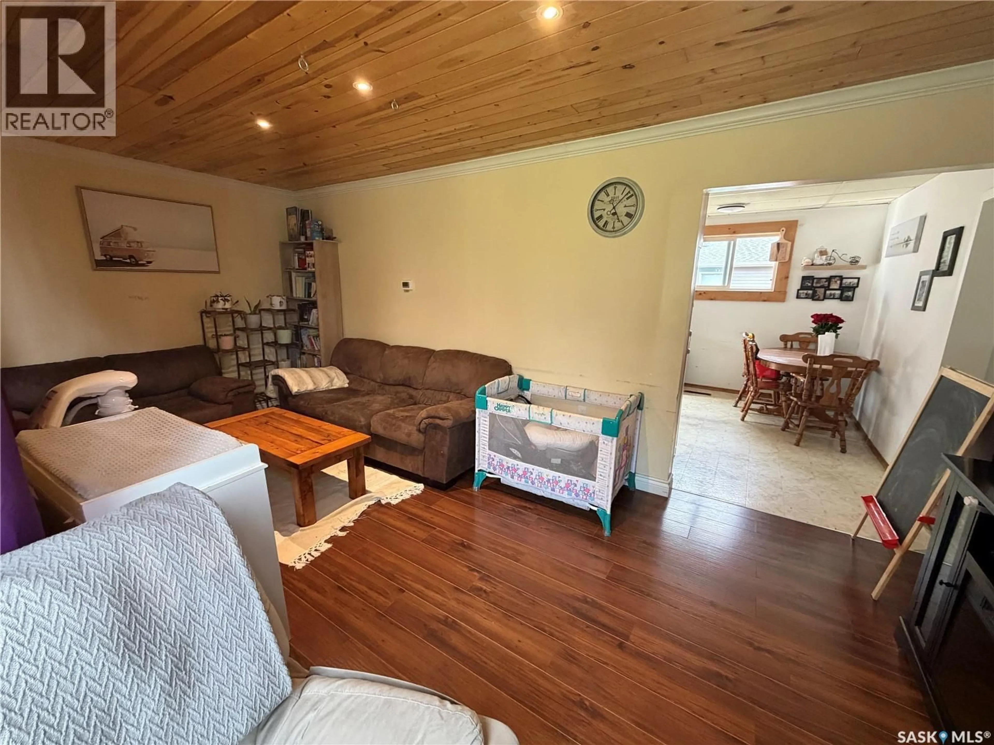 Living room with furniture, wood/laminate floor for 210 2ND AVENUE, Hepburn Saskatchewan S0K1Z0