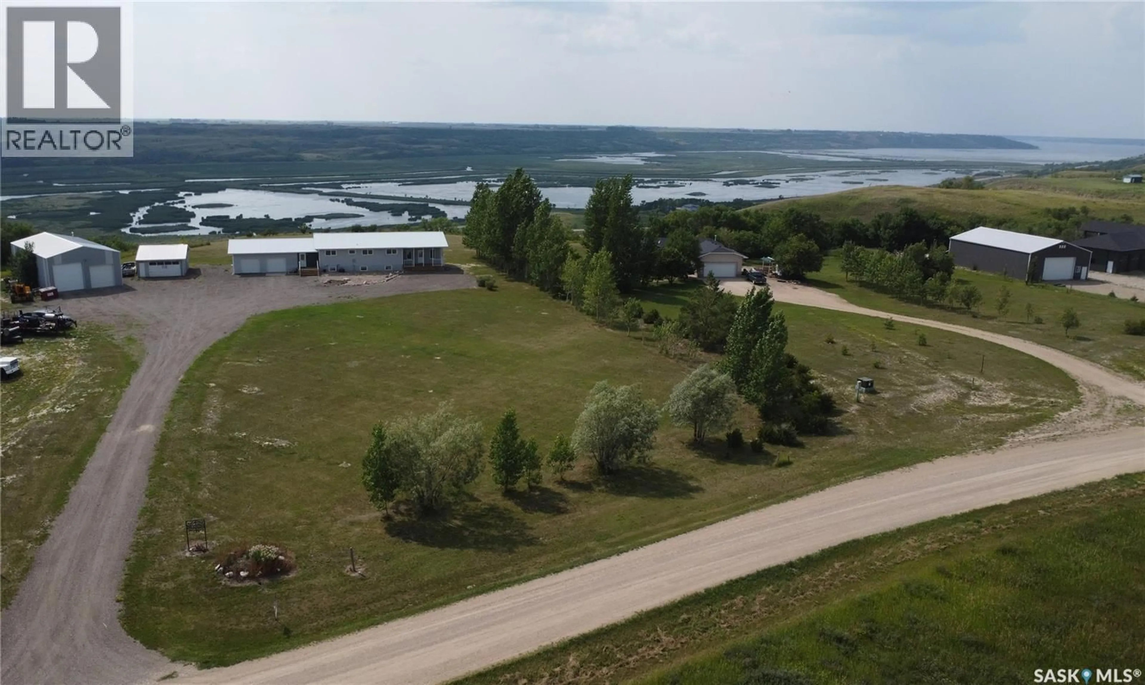 A pic from outside/outdoor area/front of a property/back of a property/a pic from drone, water/lake/river/ocean view for 13 CUMMINS ROAD, Longlaketon Rm No. 219 Saskatchewan S0G0W0