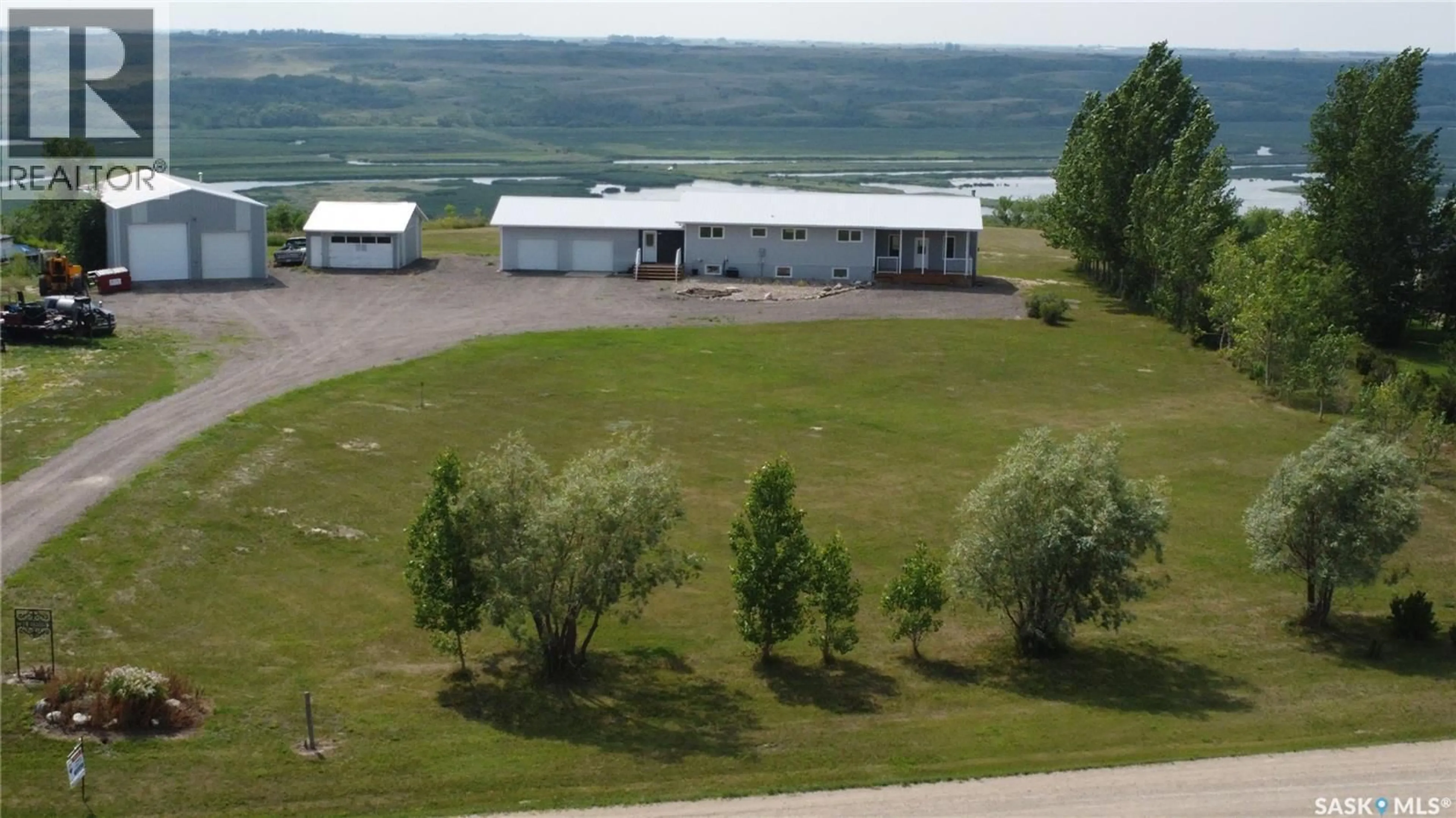 A pic from outside/outdoor area/front of a property/back of a property/a pic from drone, water/lake/river/ocean view for 13 CUMMINS ROAD, Longlaketon Rm No. 219 Saskatchewan S0G0W0