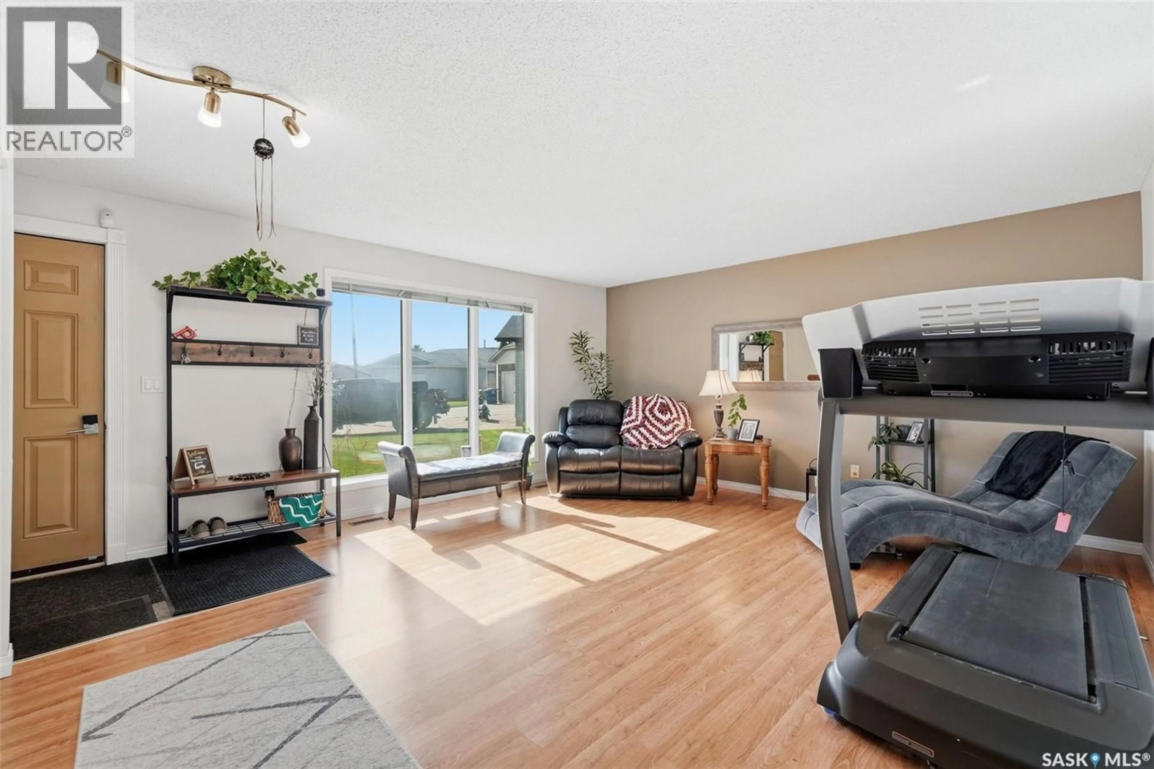 Living room with furniture, unknown for 218 WARD COURT, Saskatoon Saskatchewan S7L6Z9