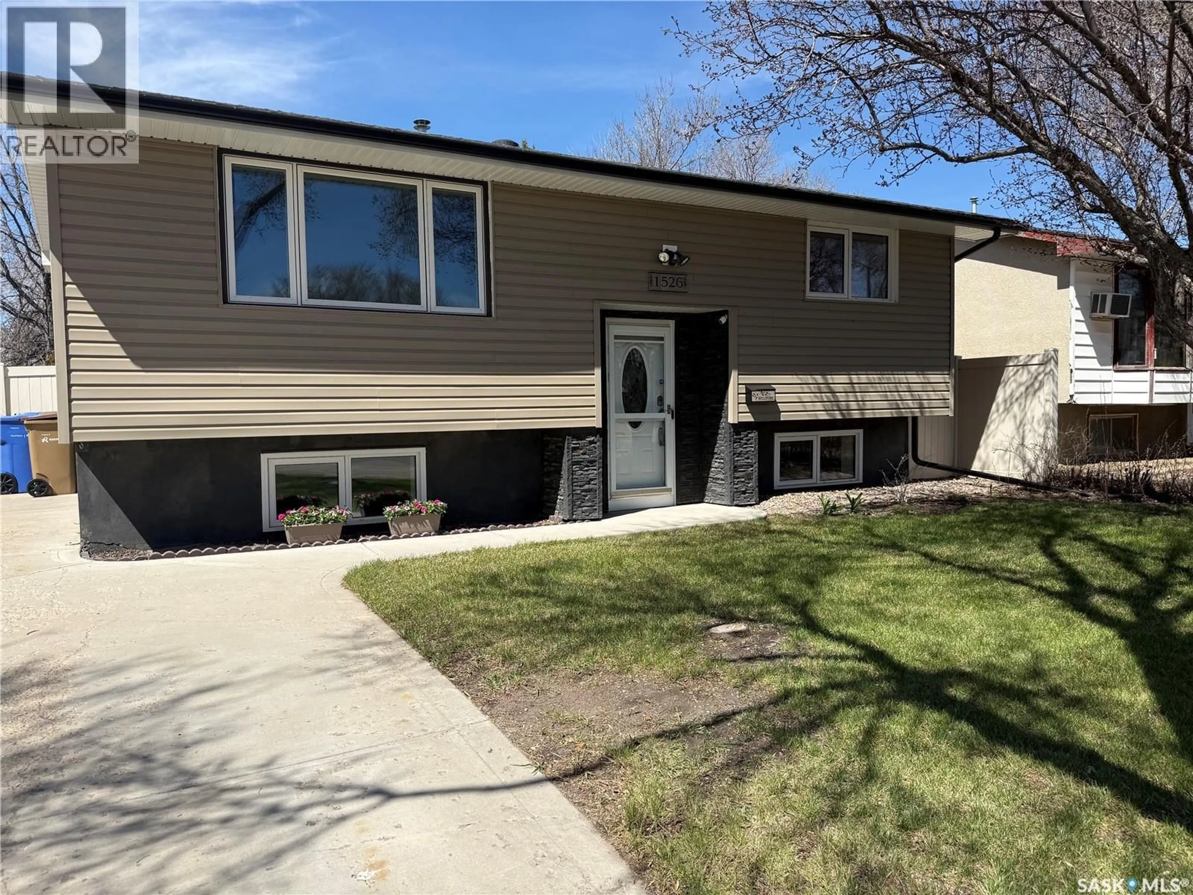 Home with vinyl exterior material, street for 1526 BROWN STREET, Regina Saskatchewan S4N4R7