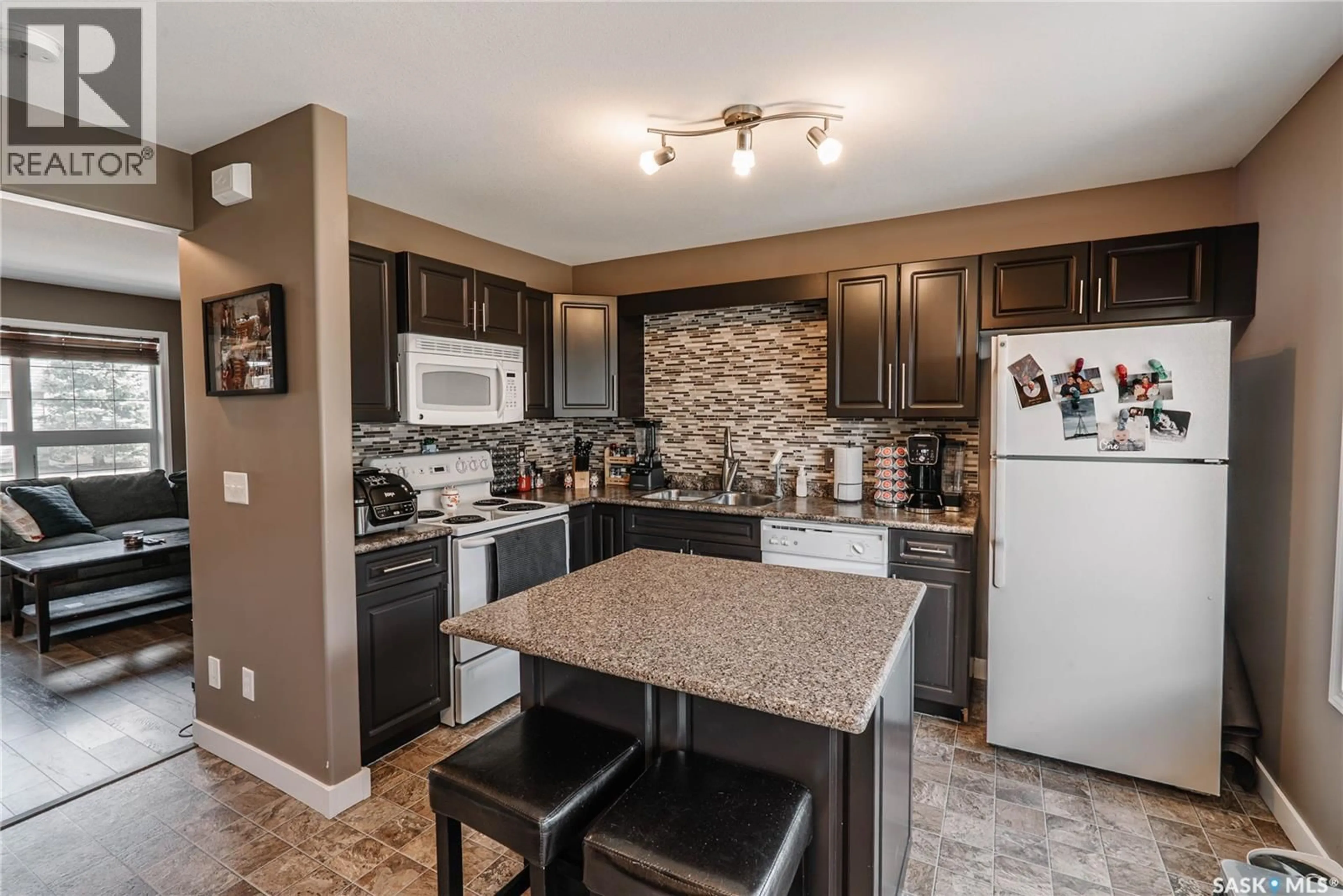 Open concept kitchen, ceramic/tile floor for 10 - 300 MACCORMACK ROAD, Martensville Saskatchewan S0K0A2