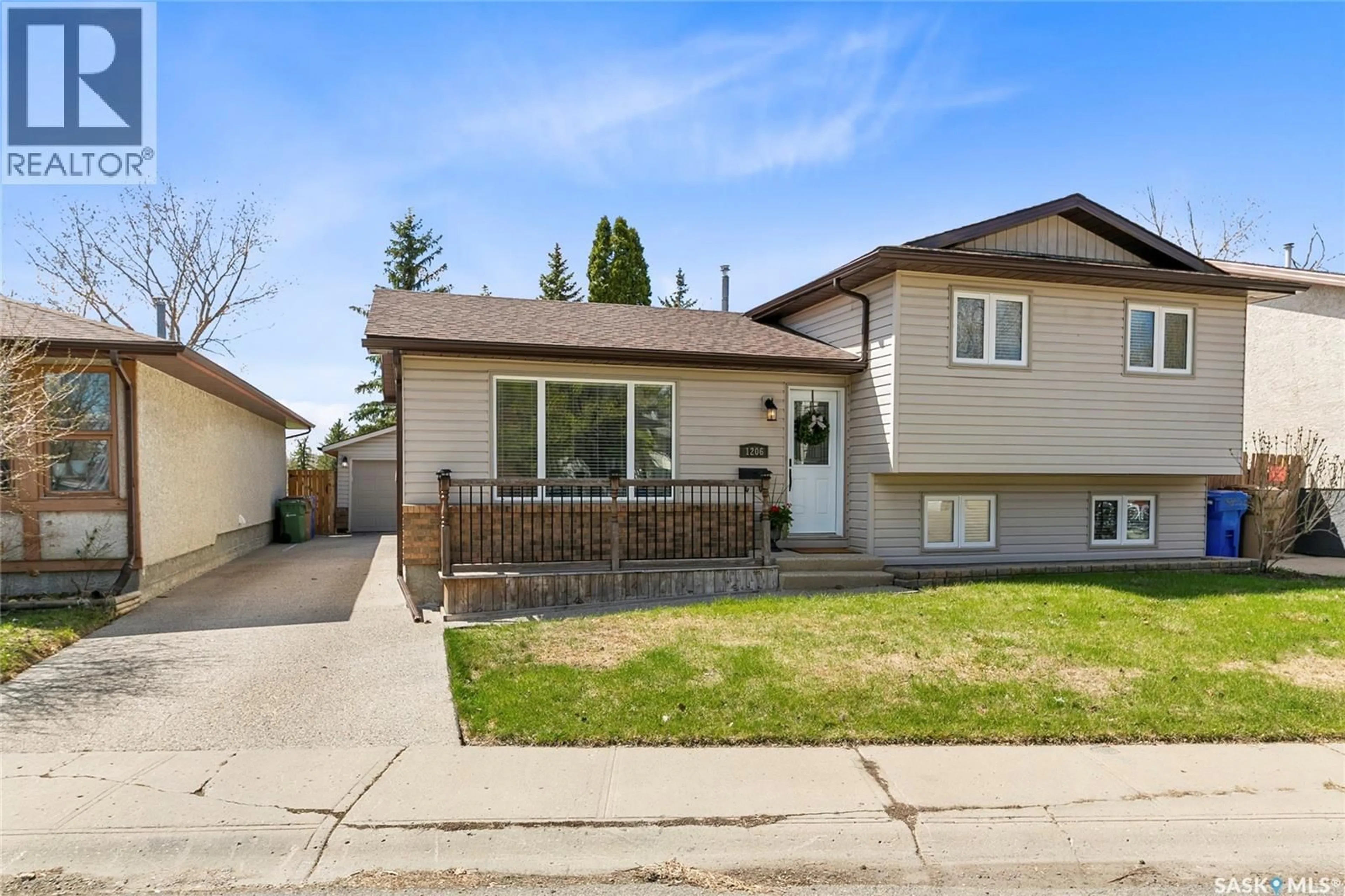 Home with vinyl exterior material, street for 1206 FLEXMAN CRESCENT, Regina Saskatchewan S4X2Y8