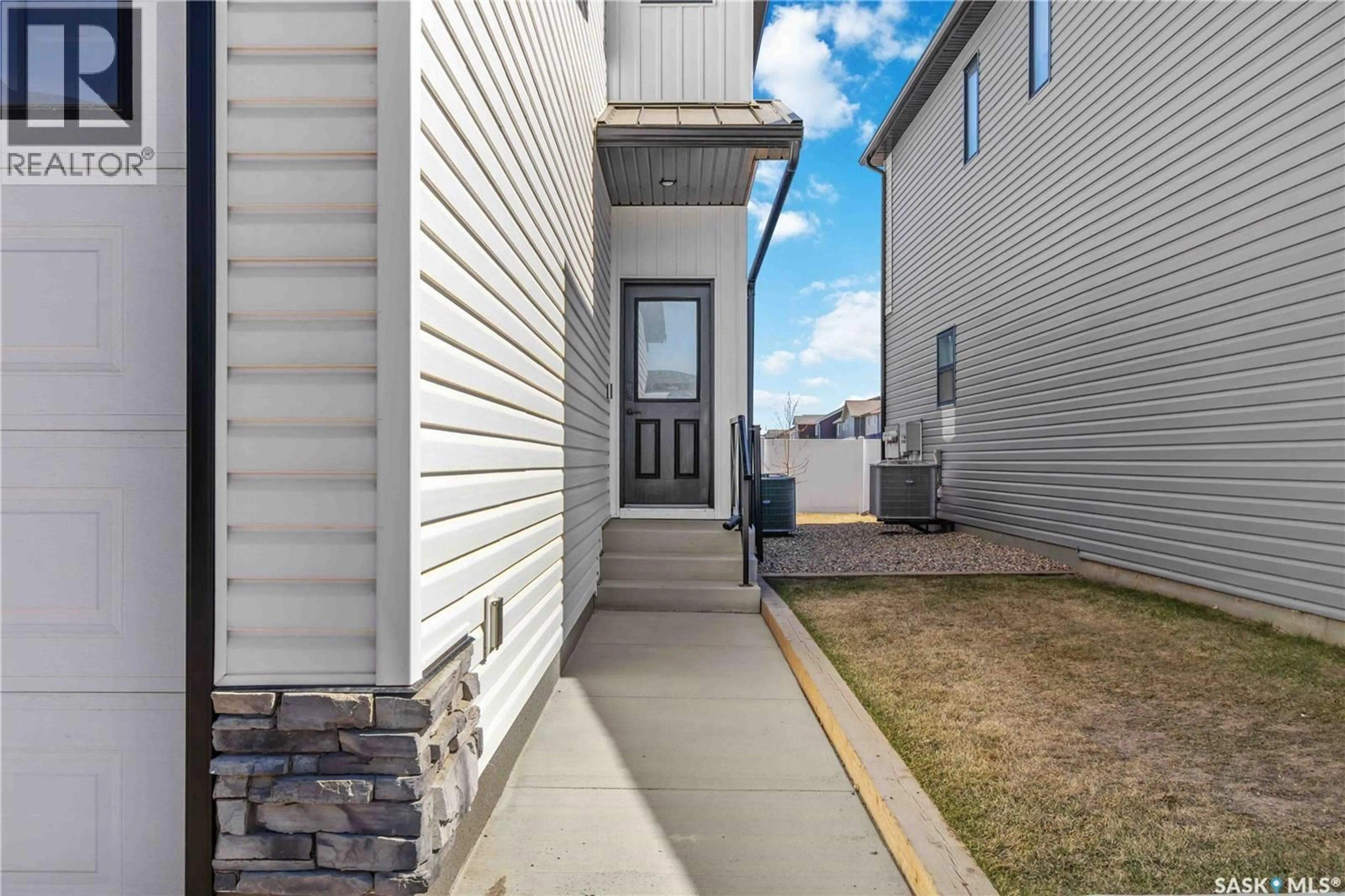 Home with vinyl exterior material, street for 26 625 DAGNONE CRESCENT, Saskatoon Saskatchewan S7V1K9