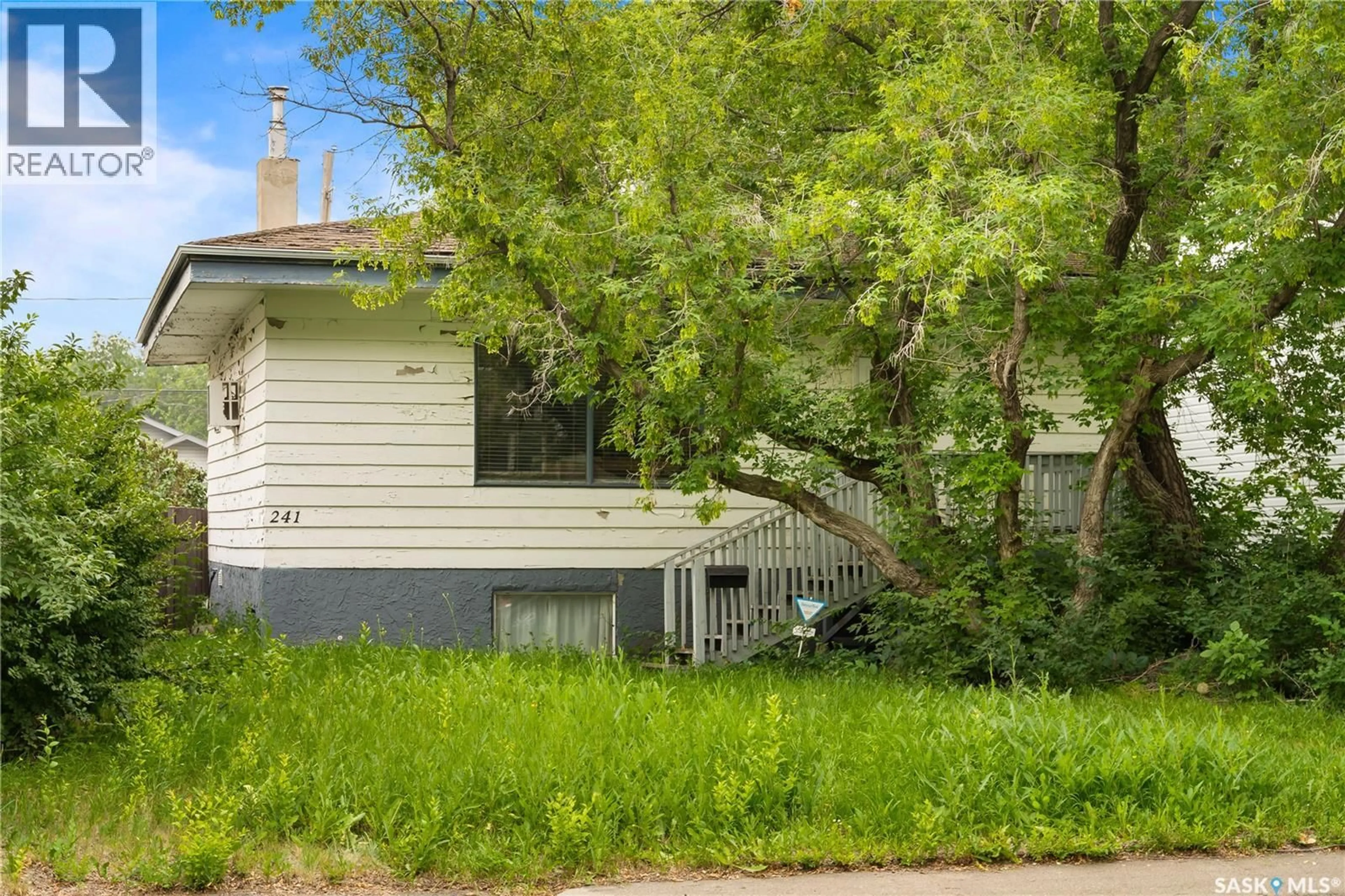 Home with vinyl exterior material, street for 241 ST JOHN STREET, Regina Saskatchewan S4R1P8