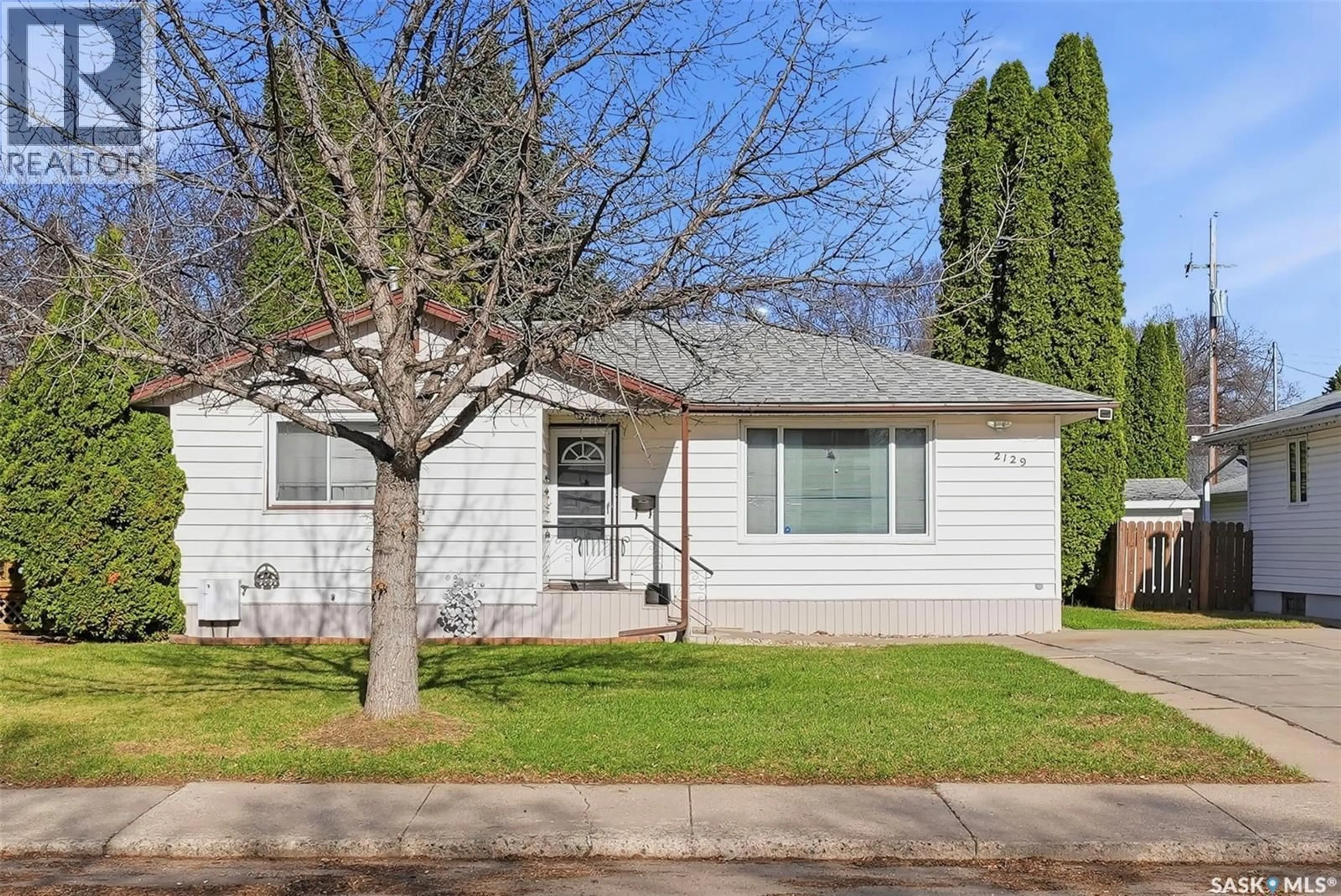 Home with vinyl exterior material, street for 2129 CAIRNS AVENUE, Saskatoon Saskatchewan S7J1T5