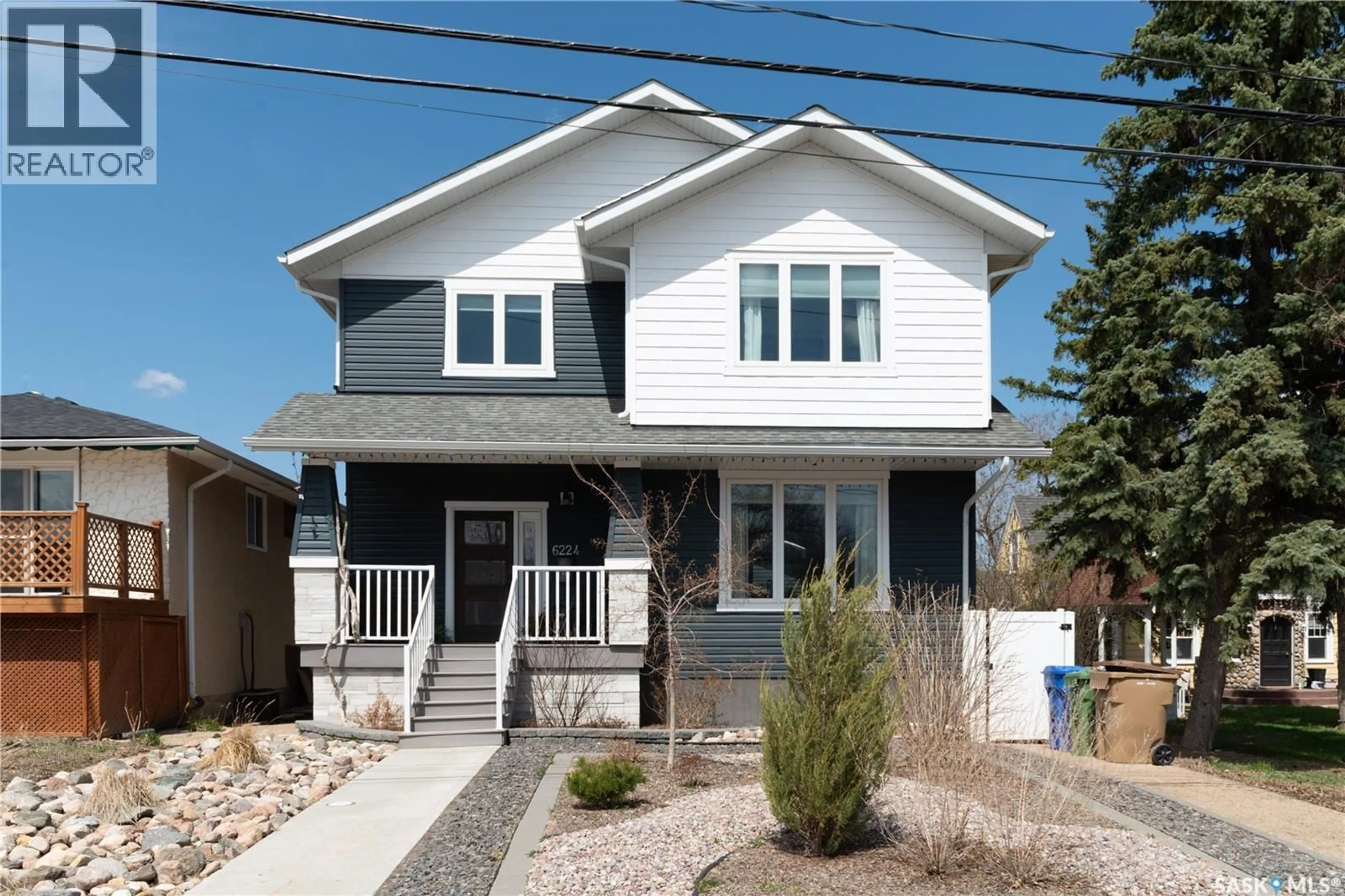 Home with vinyl exterior material, street for 6224 8TH AVENUE, Regina Saskatchewan S4T0W8