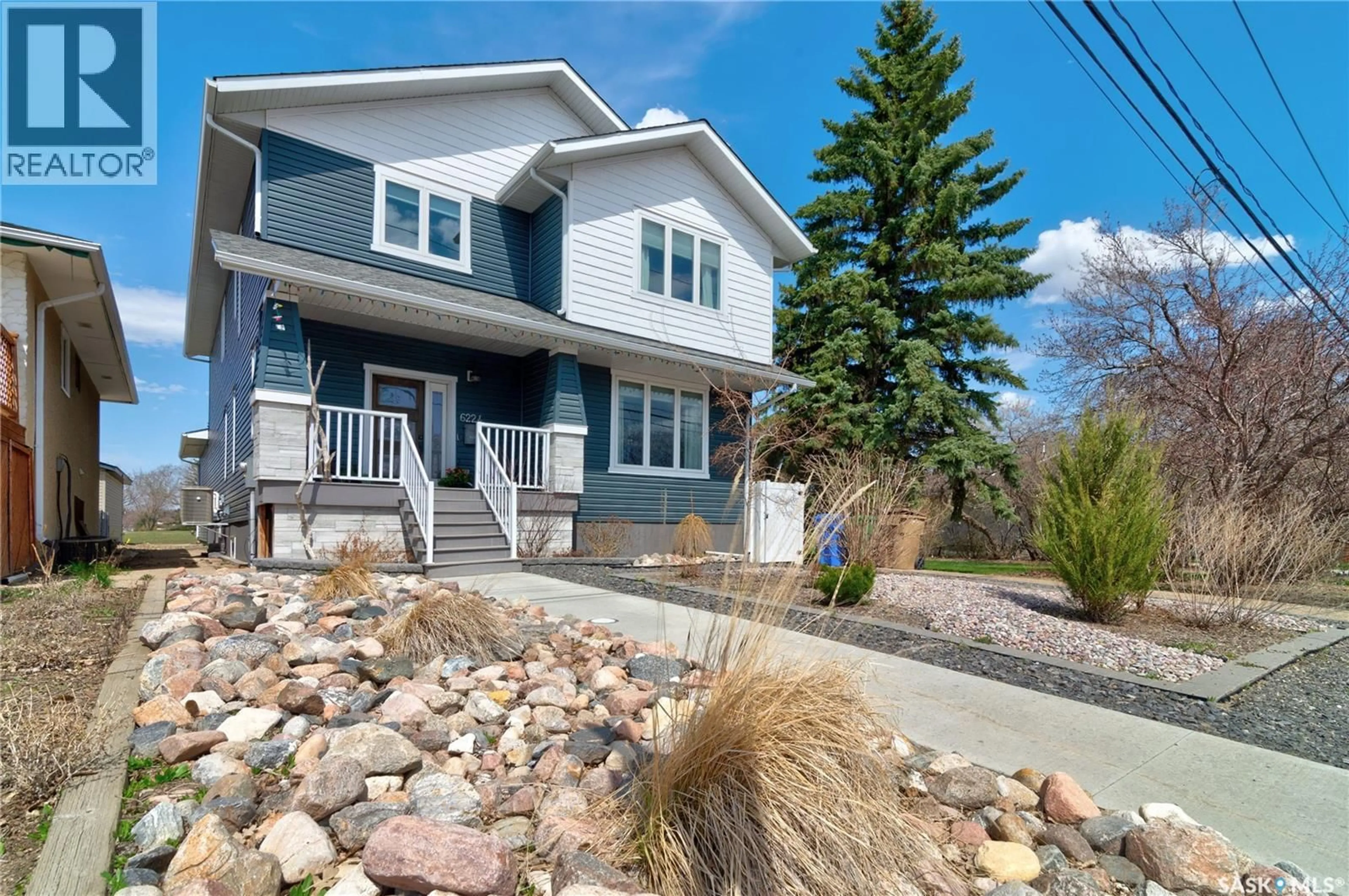 Home with vinyl exterior material, street for 6224 8TH AVENUE, Regina Saskatchewan S4T0W8