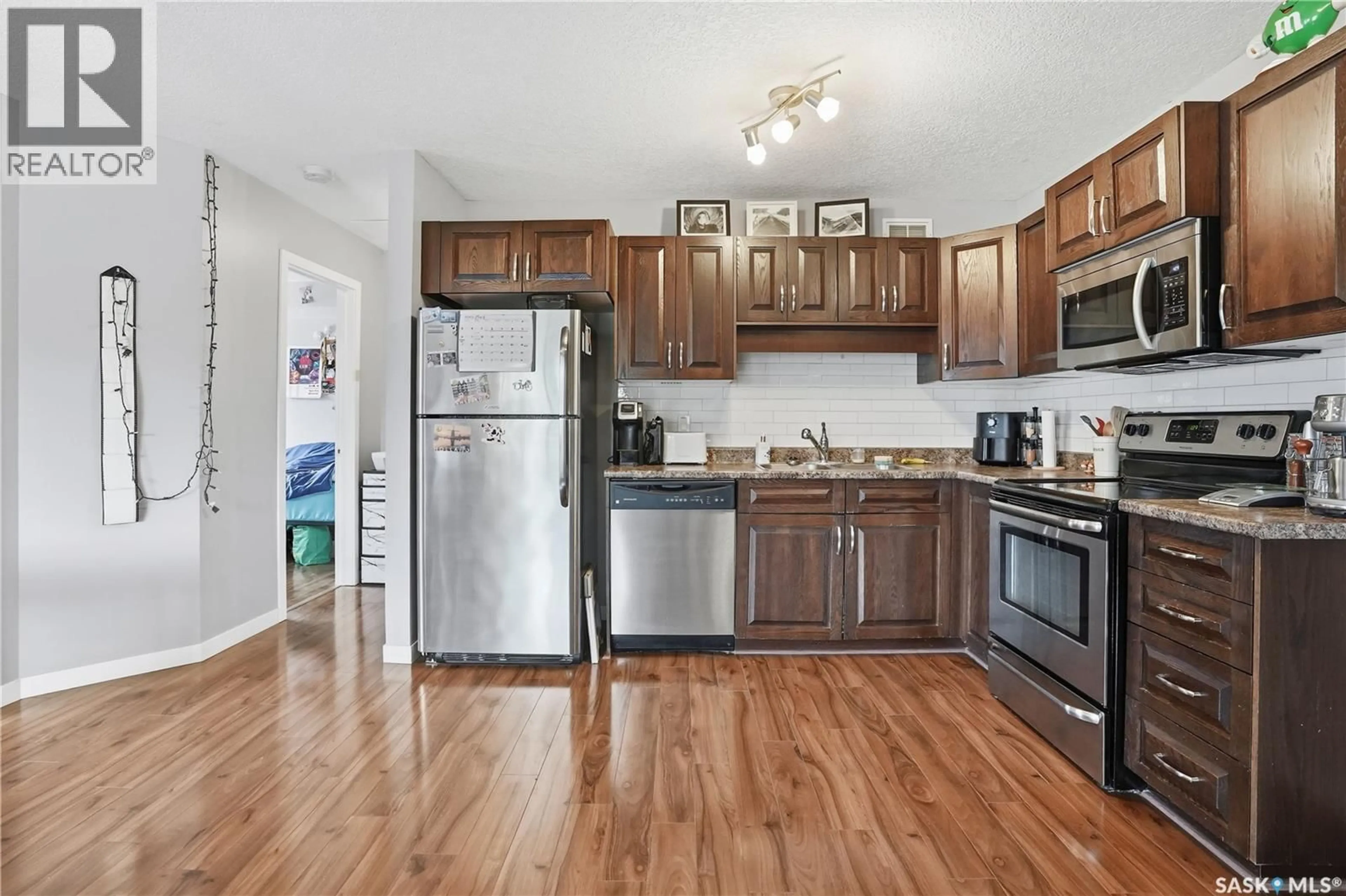 Standard kitchen, wood/laminate floor for 114 5055 JAMES HILL ROAD, Regina Saskatchewan S4W0B9