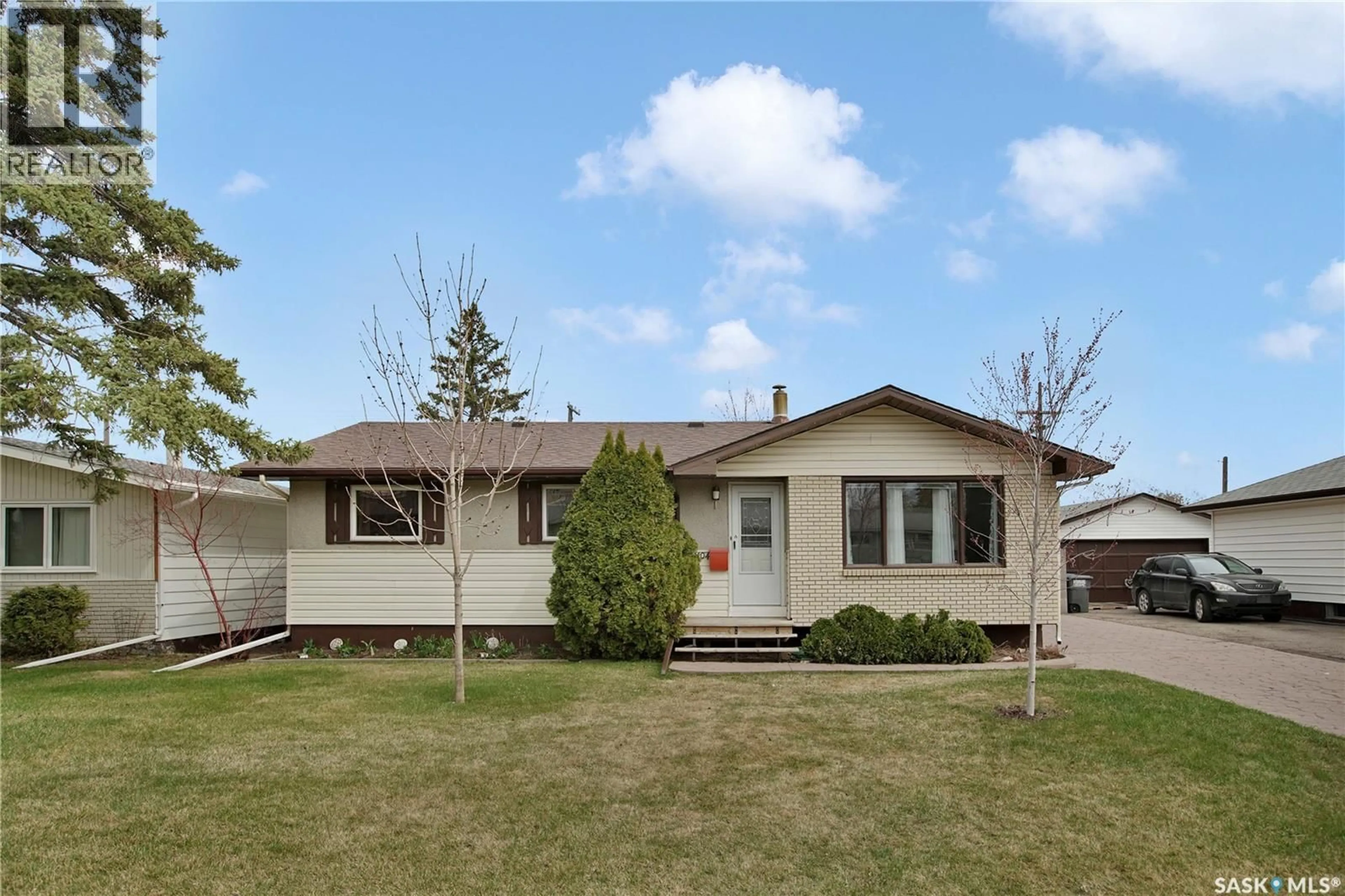 Home with vinyl exterior material, street for 1104 MCMILLAN AVENUE, Saskatoon Saskatchewan S7L2V1