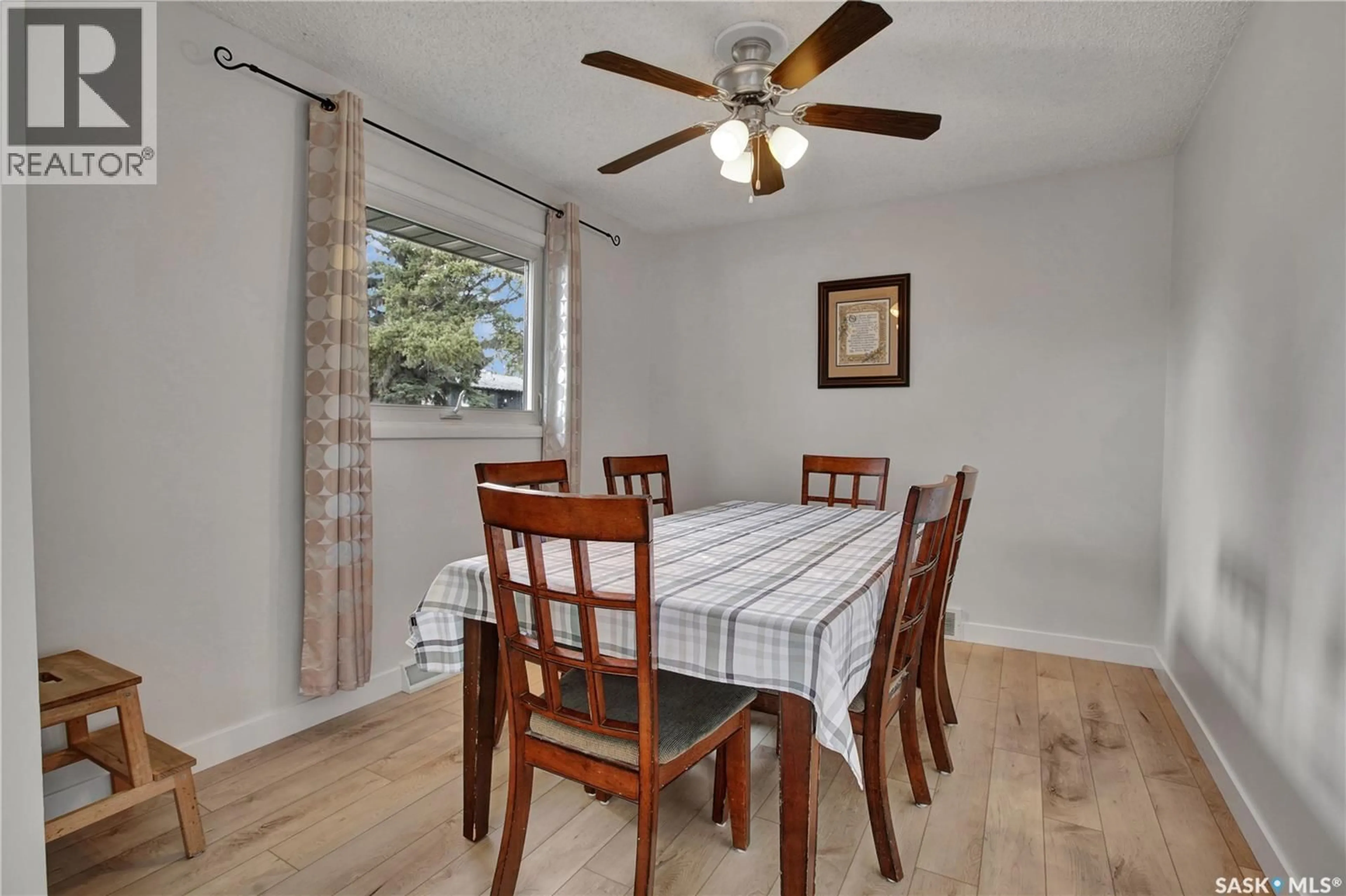 Dining room, wood/laminate floor for 1104 MCMILLAN AVENUE, Saskatoon Saskatchewan S7L2V1