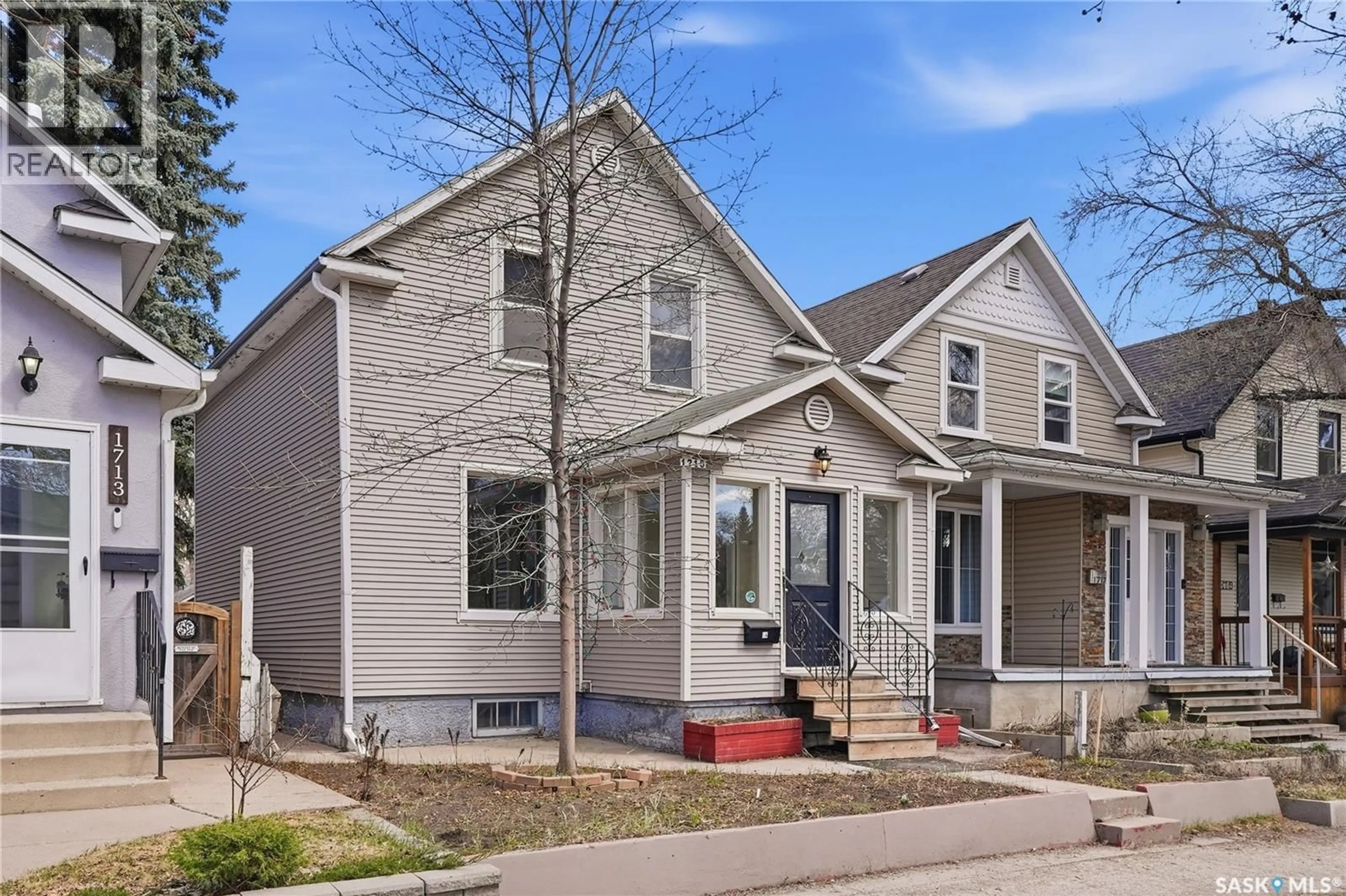Home with vinyl exterior material, street for 1715 COY AVENUE, Saskatoon Saskatchewan S7M0H8