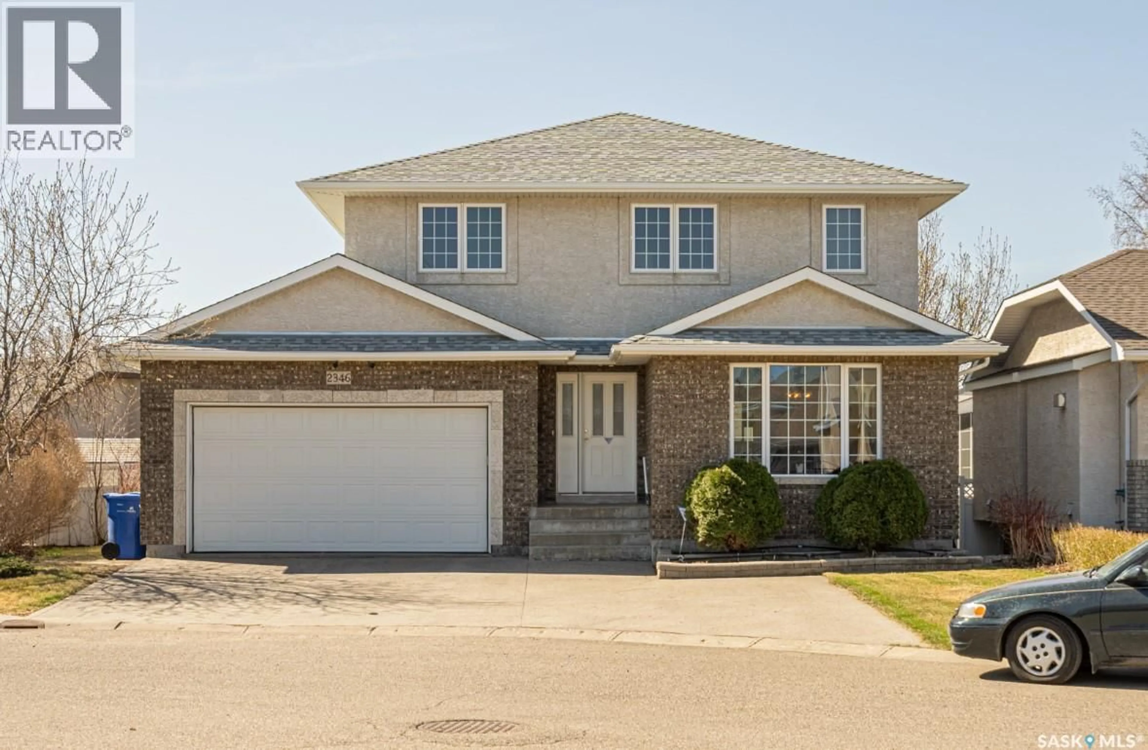 Home with brick exterior material, street for 2346 MCGREGOR PLACE, Regina Saskatchewan S4V2Y4