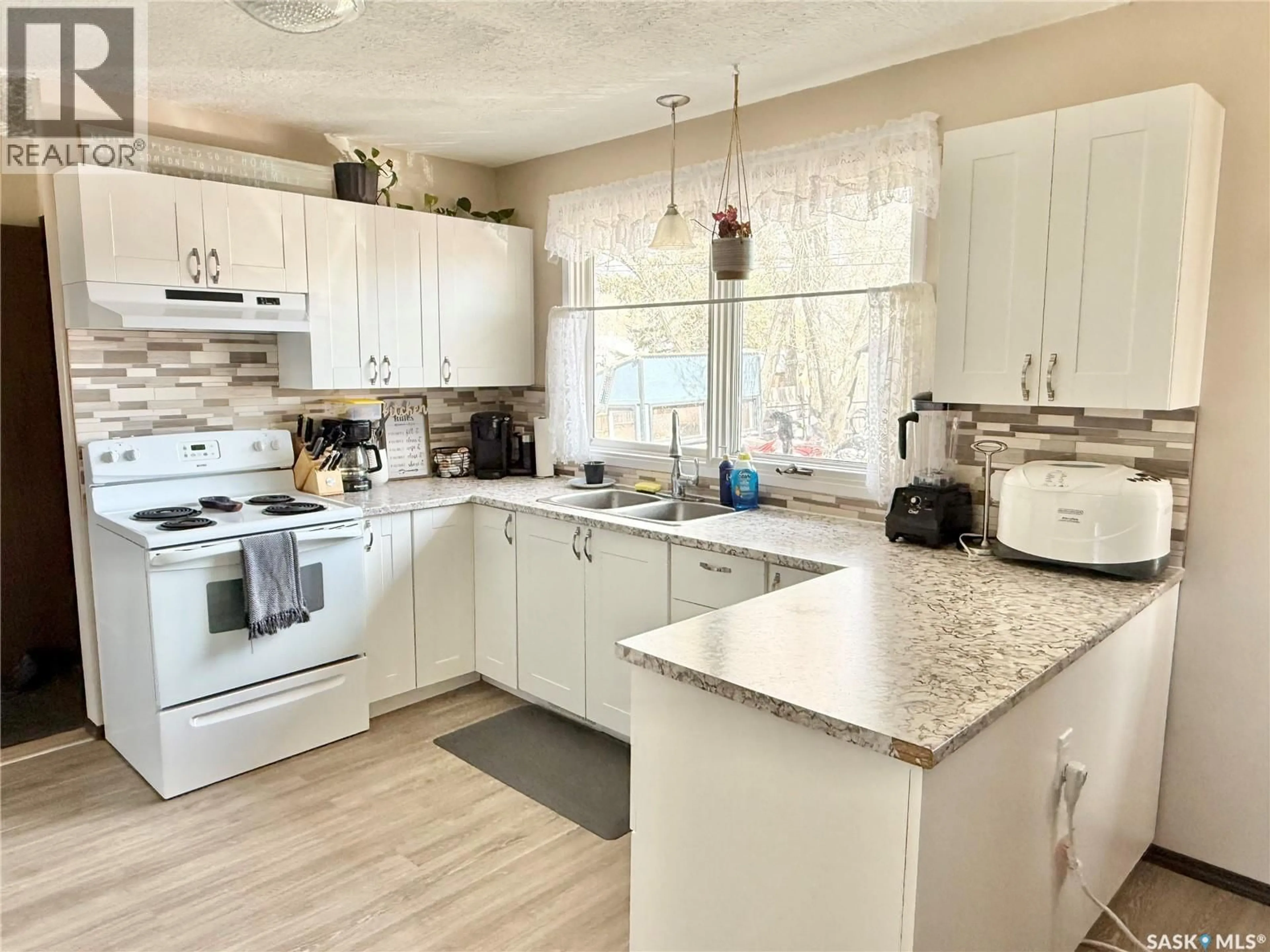 Open concept kitchen, ceramic/tile floor for 223 3RD AVENUE, Spiritwood Saskatchewan S0J2M0