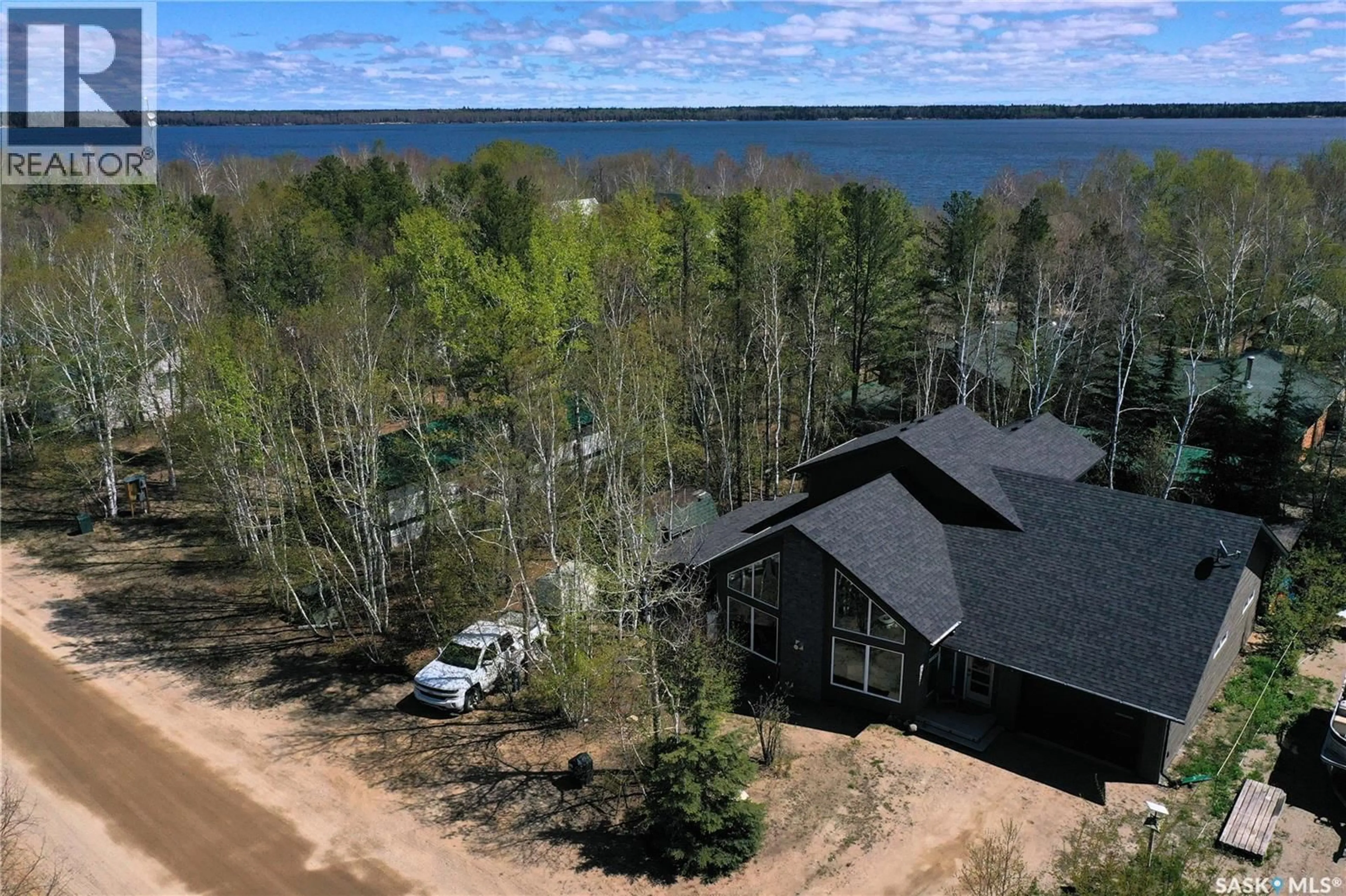 A pic from outside/outdoor area/front of a property/back of a property/a pic from drone, water/lake/river/ocean view for 213 BIRCH AVENUE, Tobin Lake Saskatchewan S0J3B0