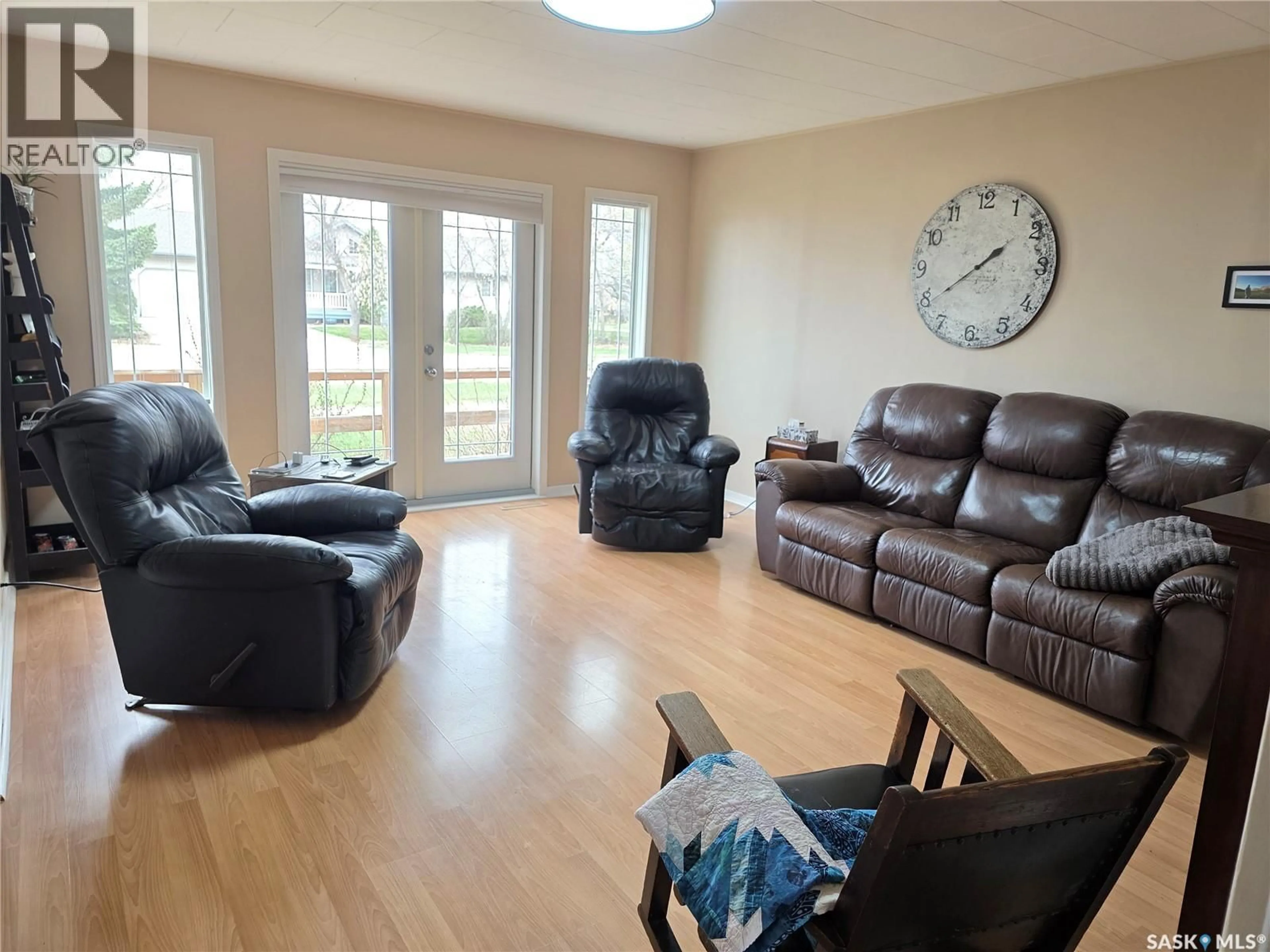 Living room with furniture, wood/laminate floor for 111 4TH AVENUE, Lucky Lake Saskatchewan S0L1Z0