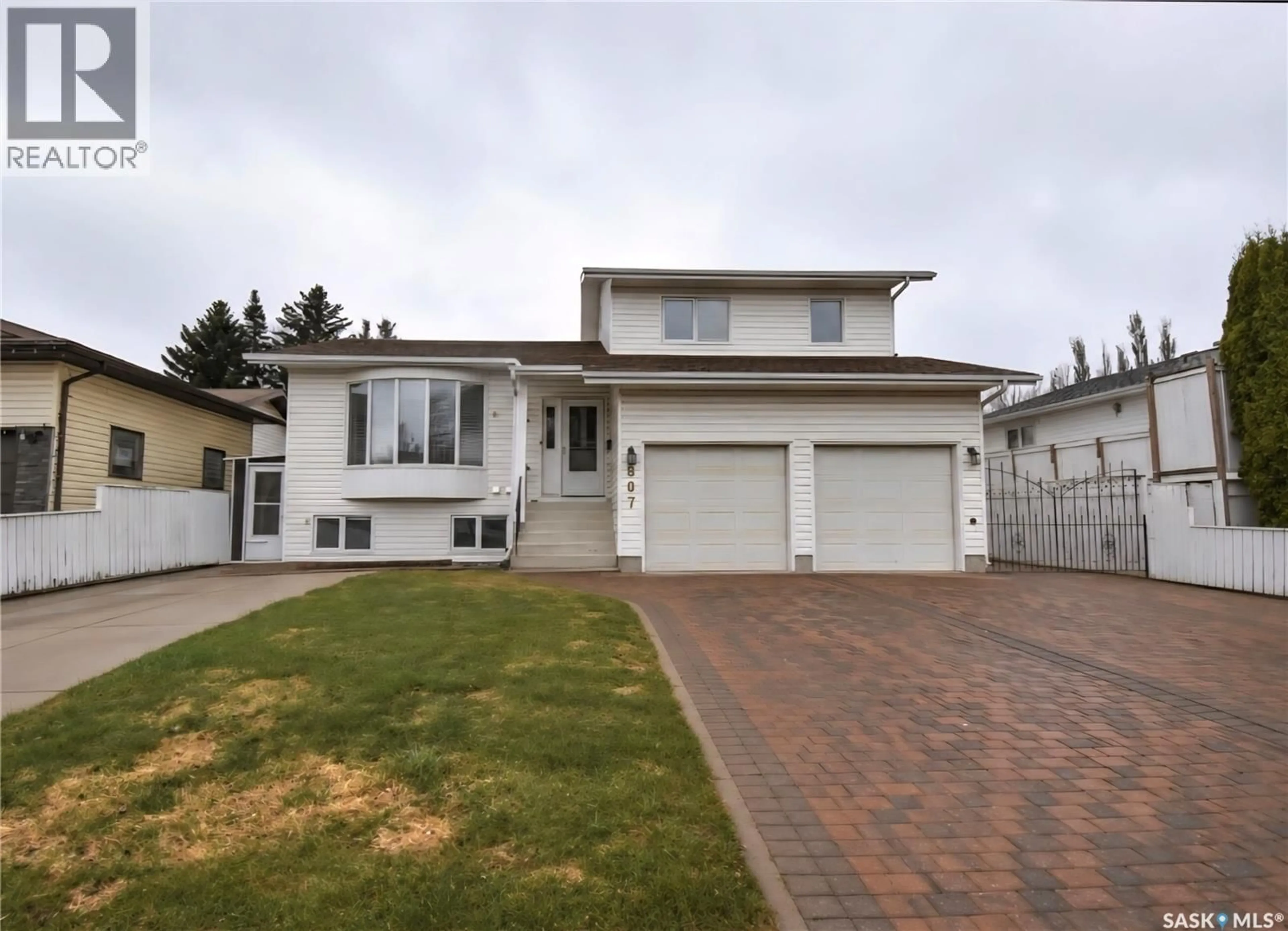 Home with vinyl exterior material, street for 807 115TH STREET, Saskatoon Saskatchewan S7N3W5