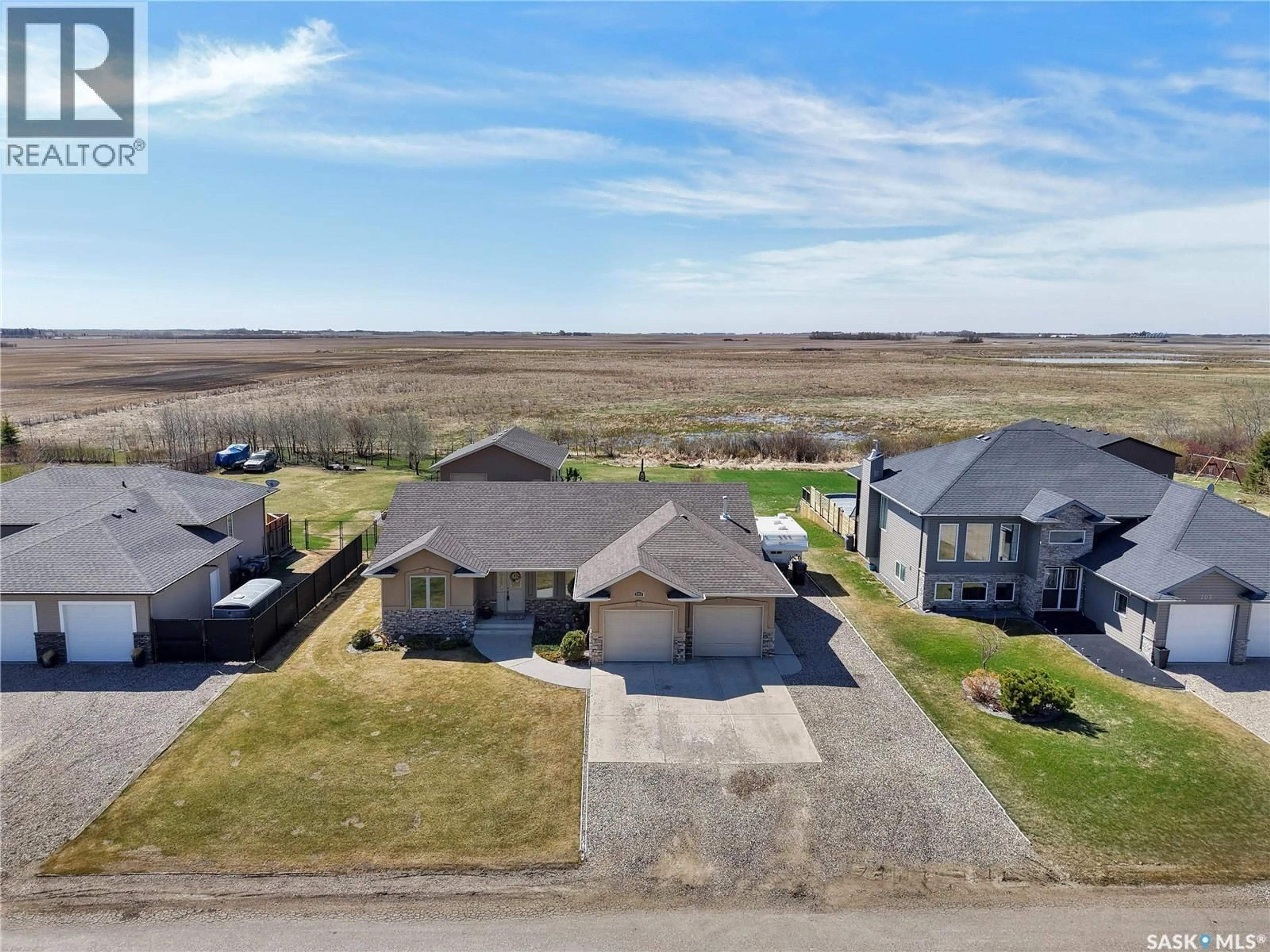 A pic from outside/outdoor area/front of a property/back of a property/a pic from drone, water/lake/river/ocean view for 205 PRAIRIE VIEW COURT, Hepburn Saskatchewan S0K1Z0