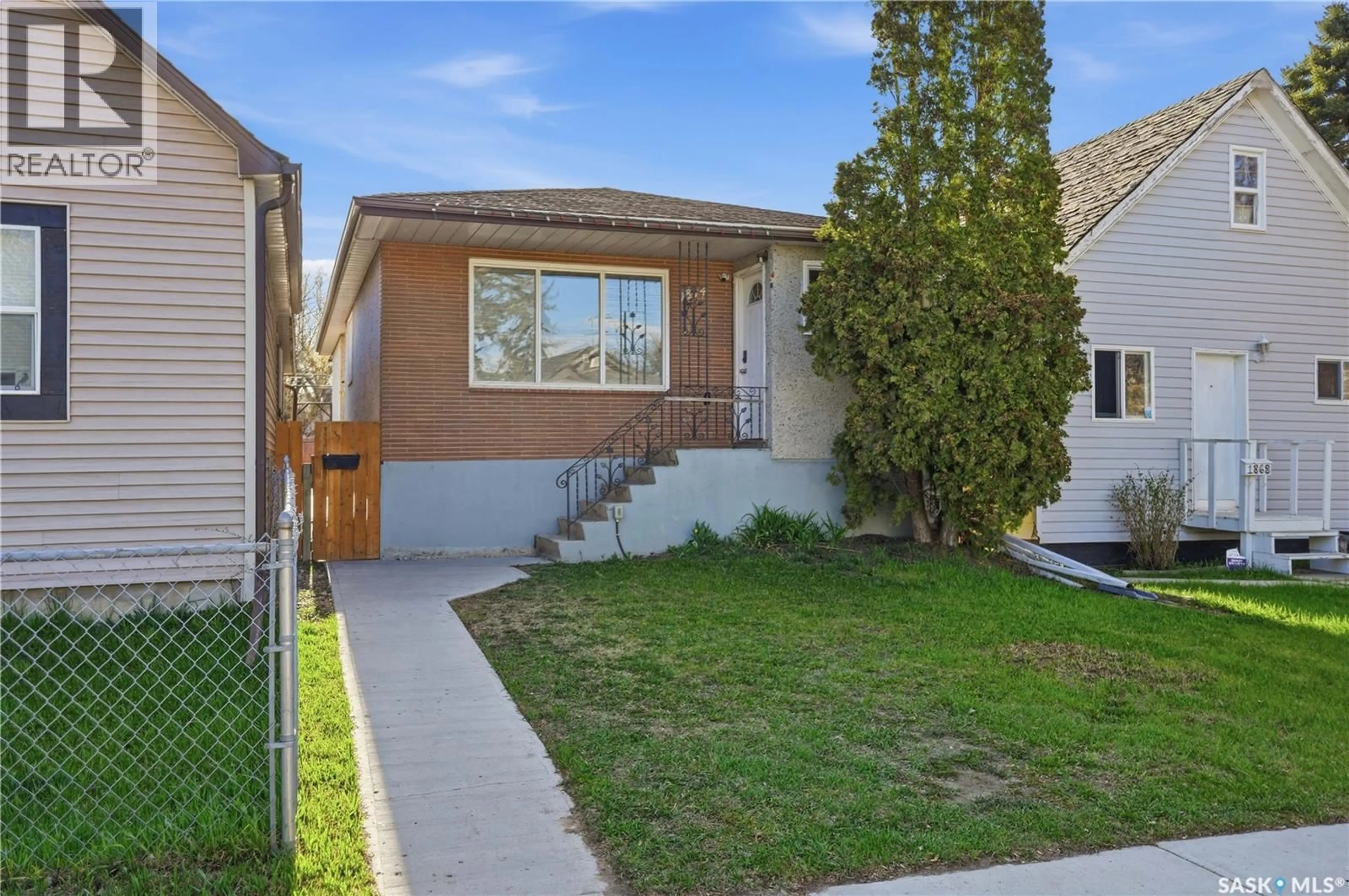 Home with vinyl exterior material, street for 1874 BRODER STREET, Regina Saskatchewan S4N3R8