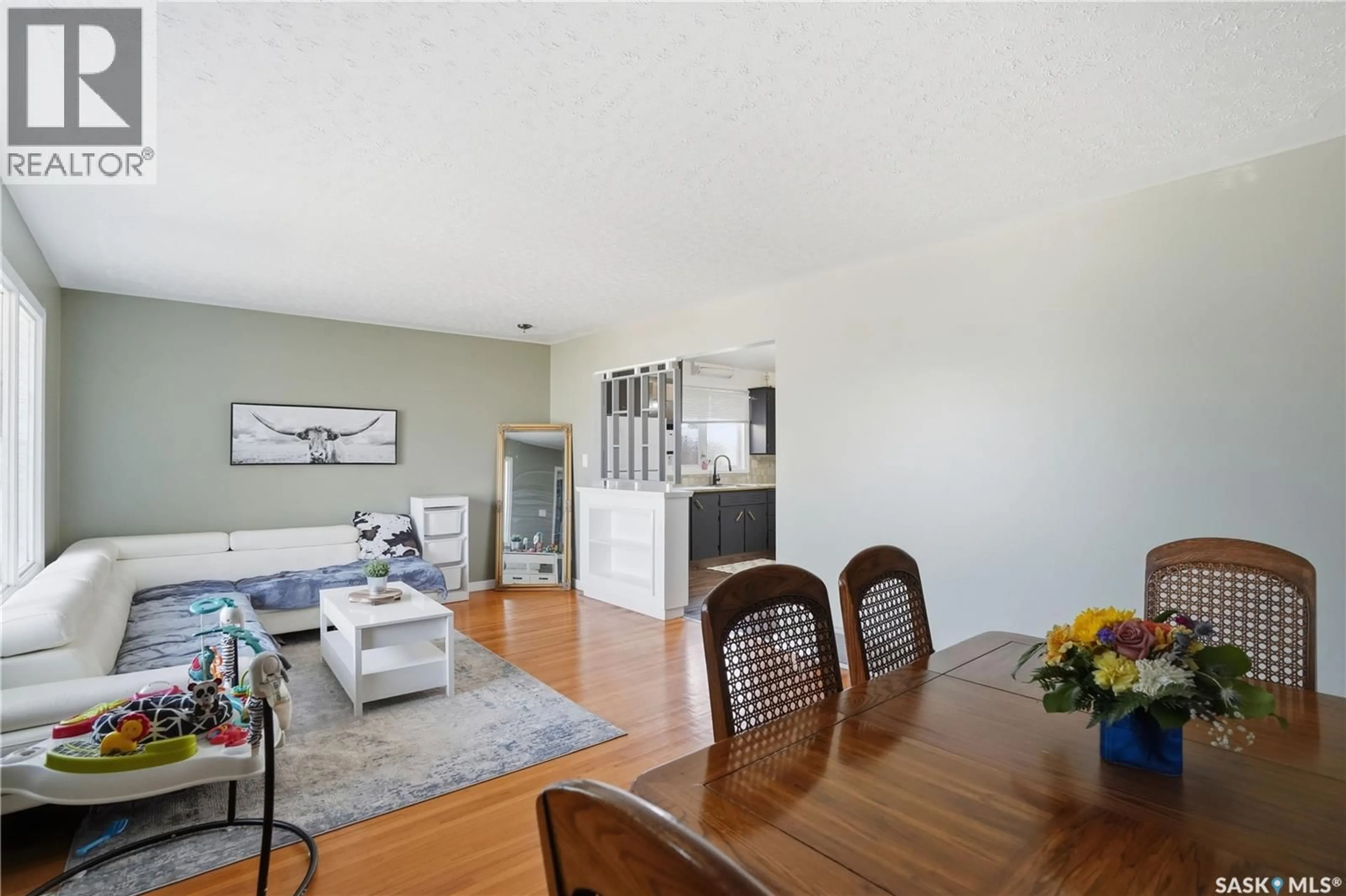 Dining room, wood/laminate floor for 1874 BRODER STREET, Regina Saskatchewan S4N3R8