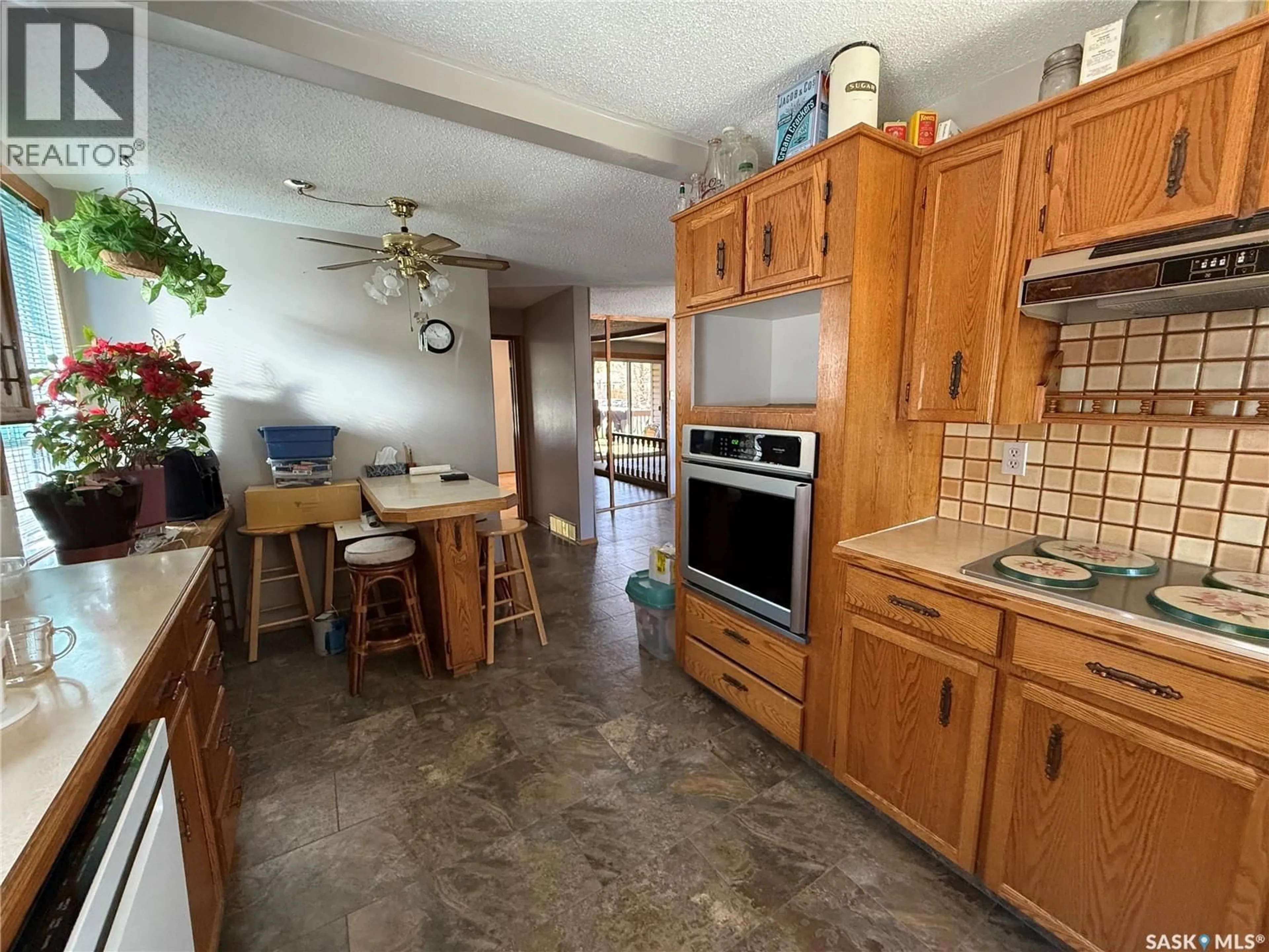 Open concept kitchen, ceramic/tile floor for 72 11TH STREET, Weyburn Saskatchewan S4H1J3