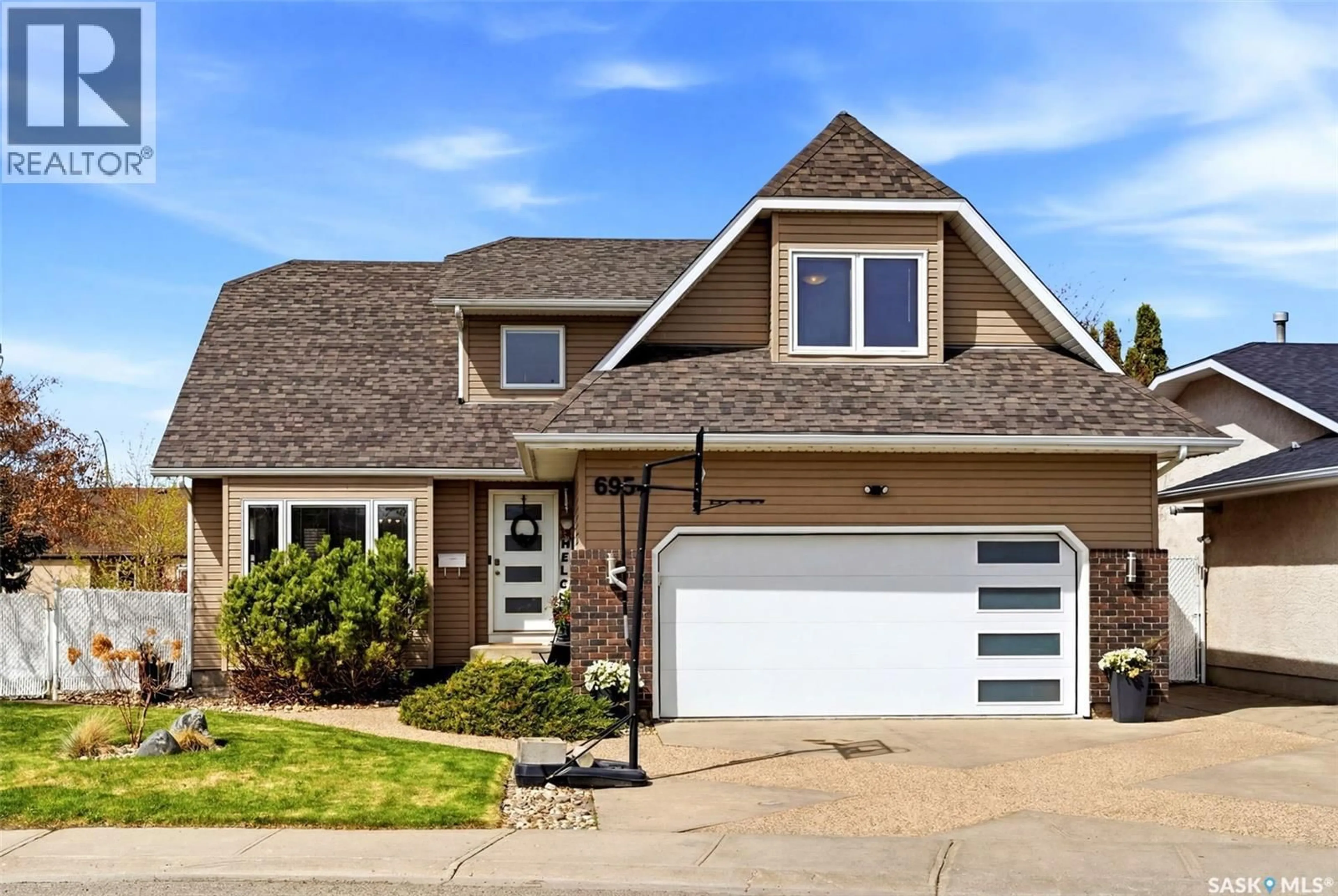 Home with vinyl exterior material, street for 6954 MAPLE BROOK CRESCENT, Regina Saskatchewan S4X4J2