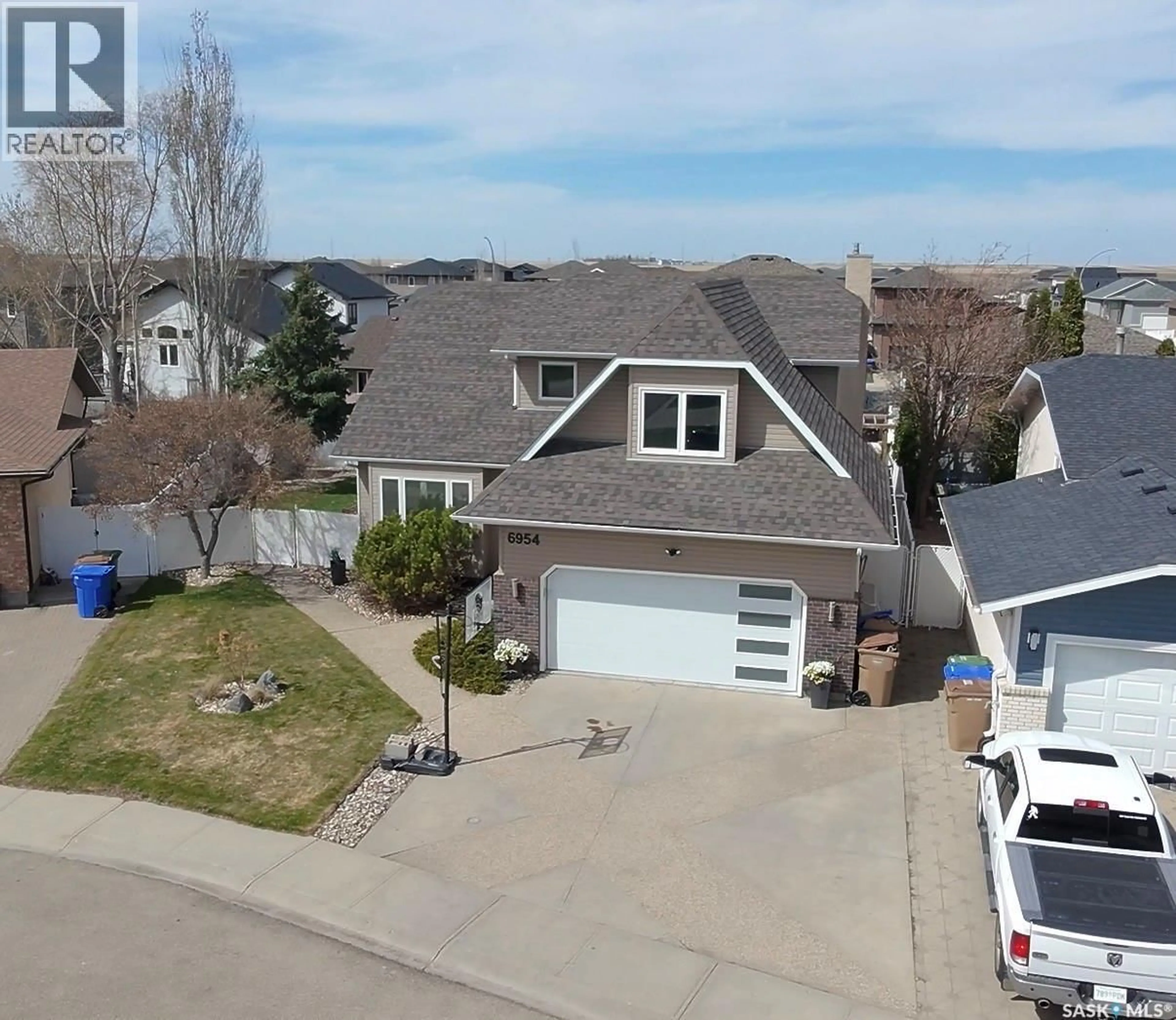 A pic from outside/outdoor area/front of a property/back of a property/a pic from drone, street for 6954 MAPLE BROOK CRESCENT, Regina Saskatchewan S4X4J2