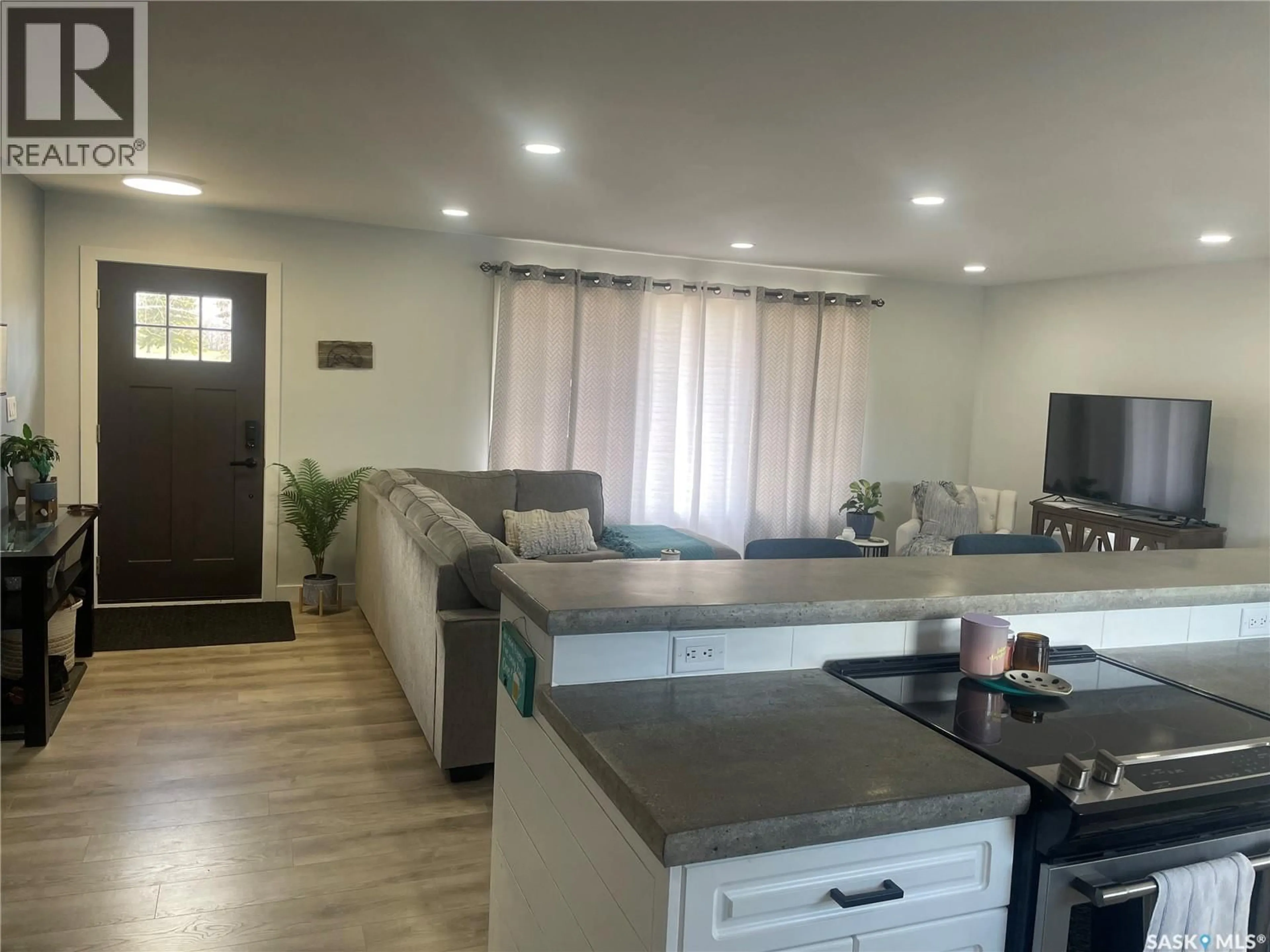 Living room with furniture, wood/laminate floor for 525 6TH STREET, Wadena Saskatchewan S0A4J0