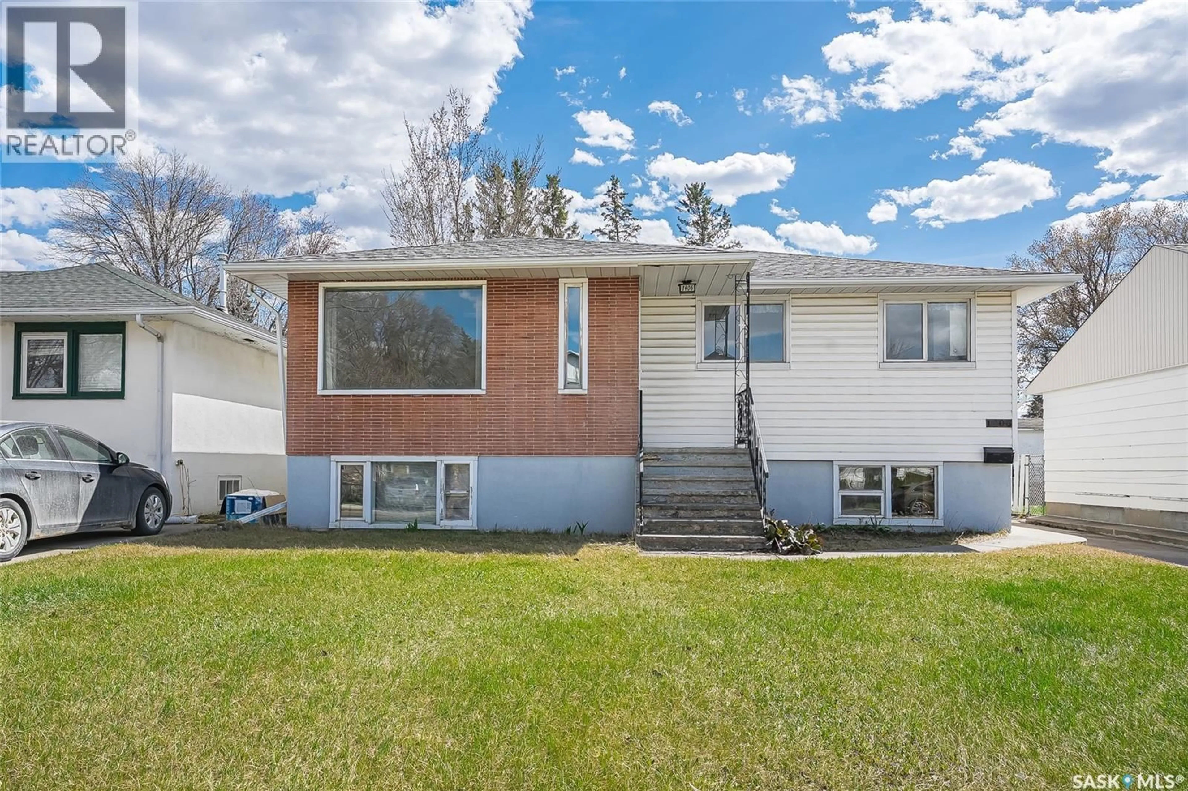Home with vinyl exterior material, street for 1406 12TH STREET, Saskatoon Saskatchewan S7H0E8