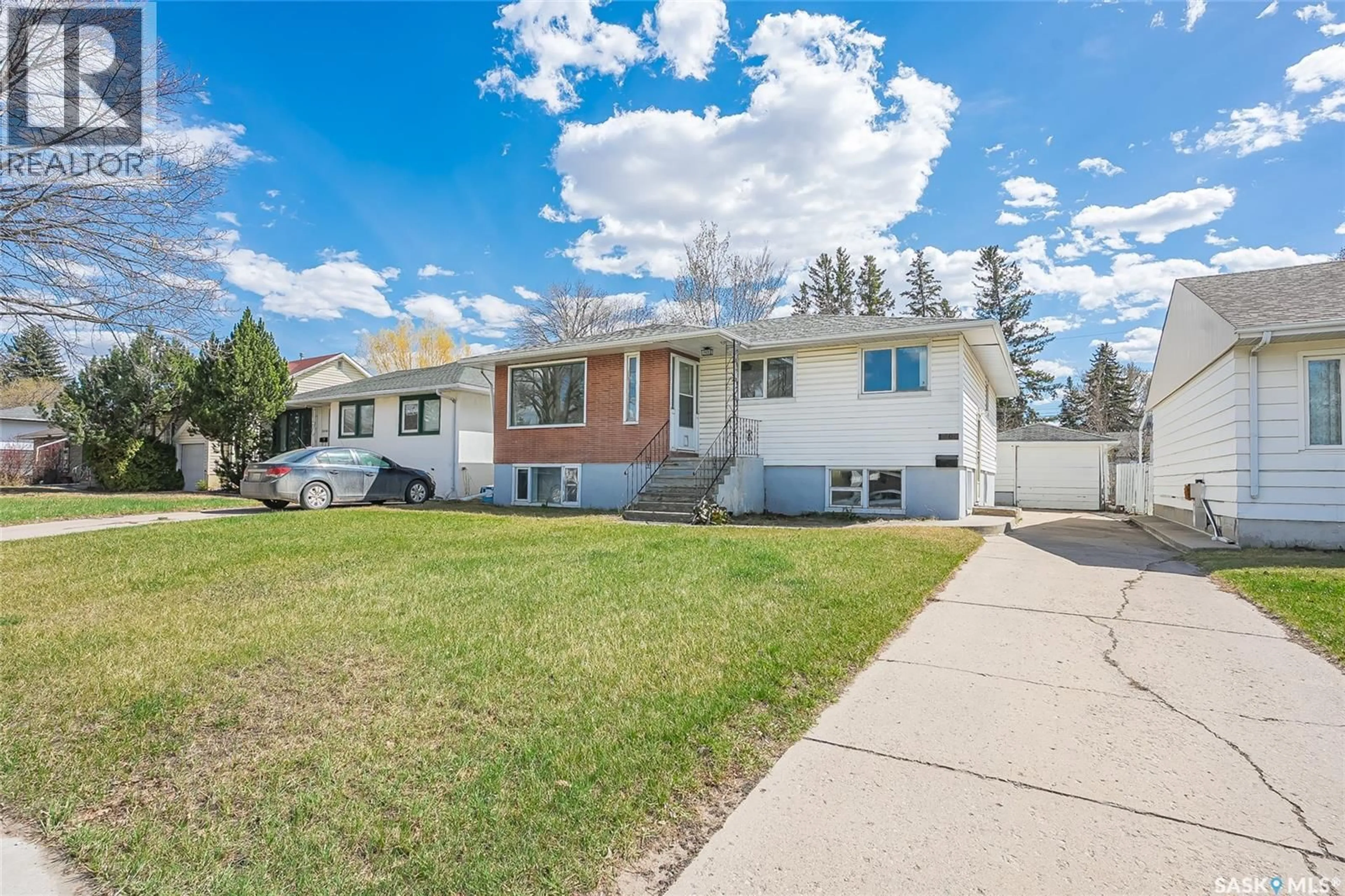 Home with vinyl exterior material, street for 1406 12TH STREET, Saskatoon Saskatchewan S7H0E8