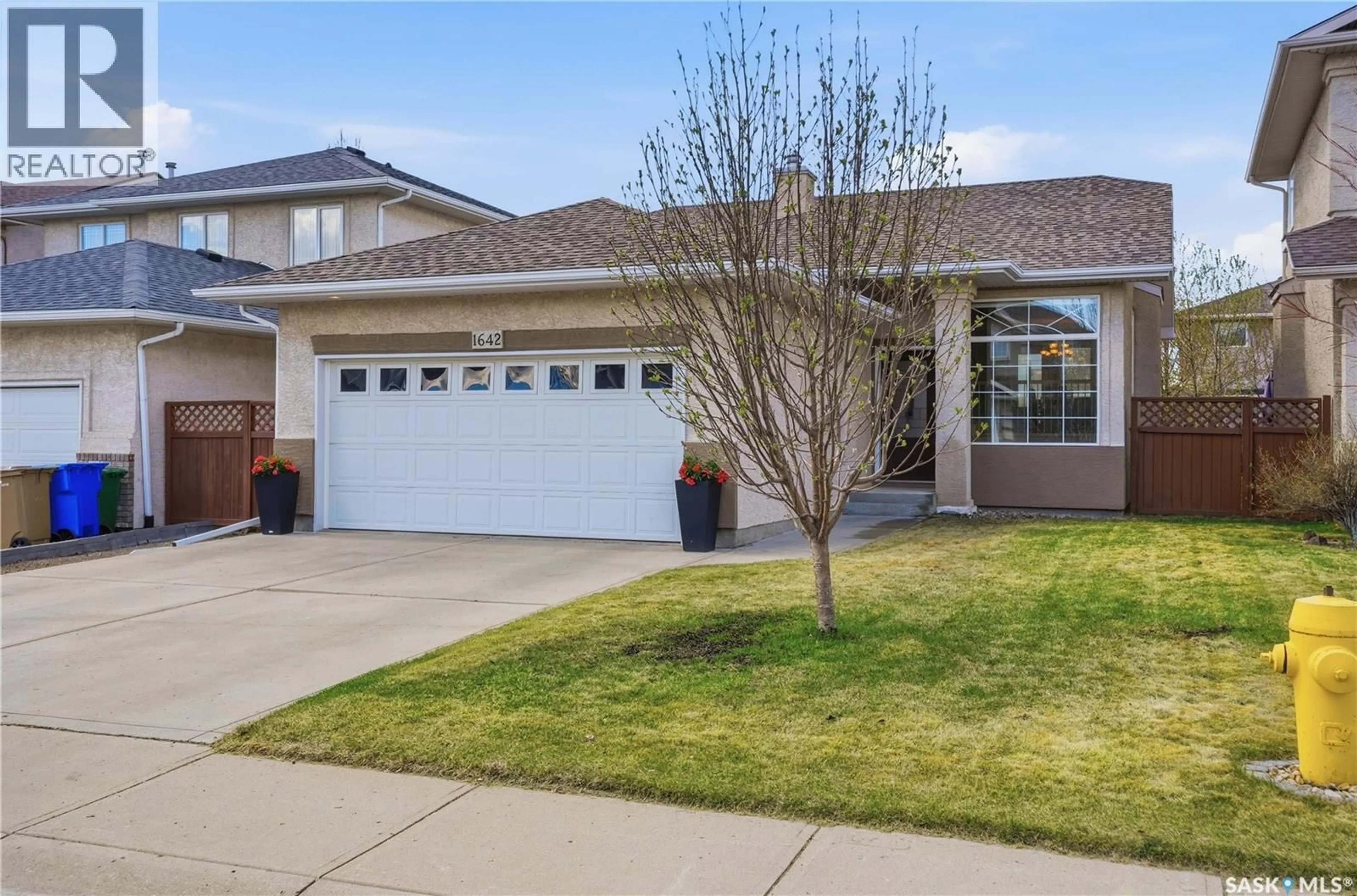 Home with vinyl exterior material, street for 1642 WINGERT DRIVE, Regina Saskatchewan S4X4P9