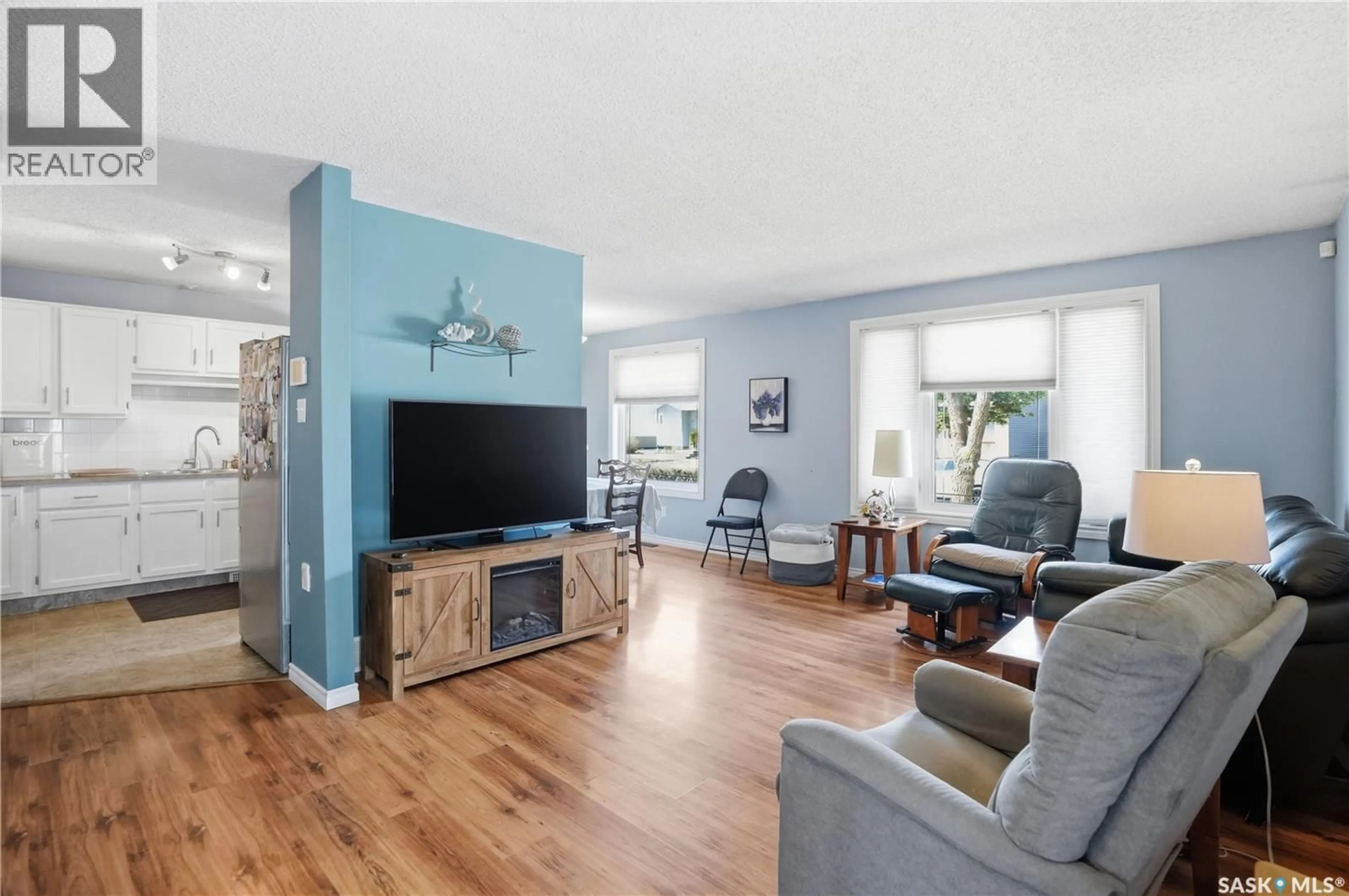 Living room with furniture, wood/laminate floor for 6831 WHELAN DRIVE, Regina Saskatchewan S4X3W2