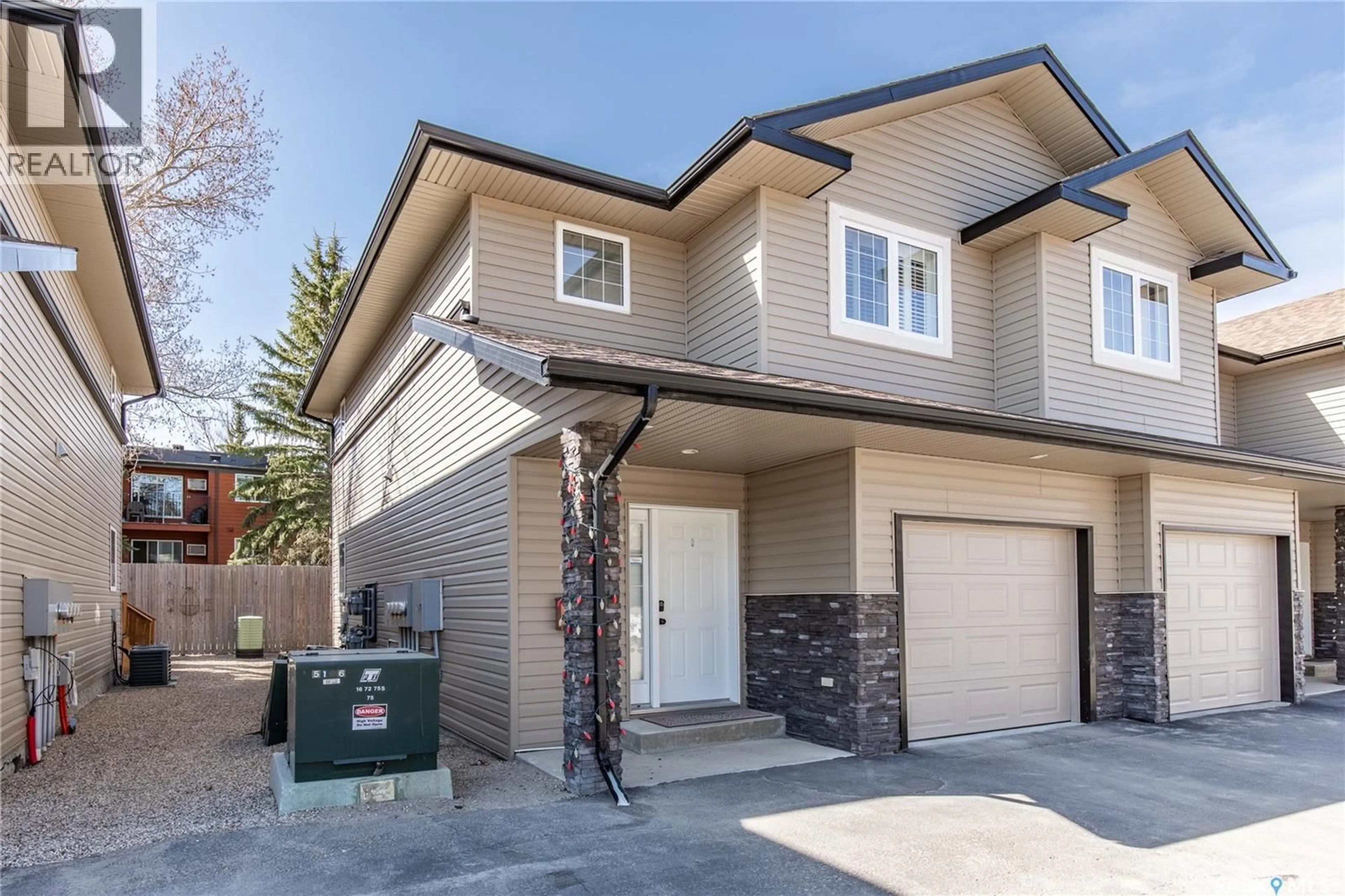 Home with brick exterior material, street for B4 - 33 WOOD LILY DRIVE, Moose Jaw Saskatchewan S6J1E6